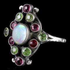 Arts & Crafts Peridot Ruby Opal Ring, circa 1900