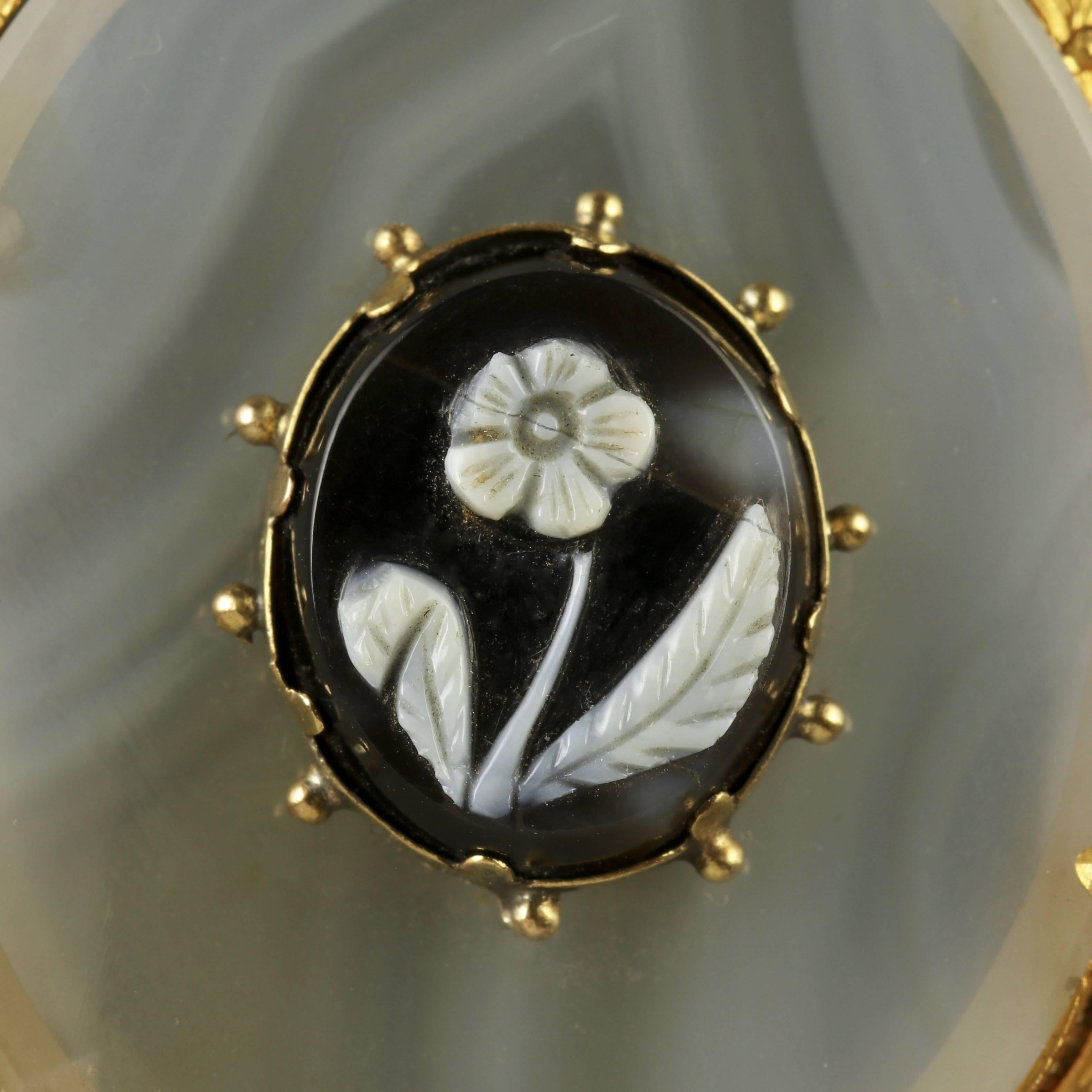 To read more please click continue reading below-

This genuine Antique Victorian pendant has a fabulous hand carved Hardstone Cameo in the centre all set in 15ct Yellow Gold.

The chalcedony Agate displays a beautiful platform for the Hardstone