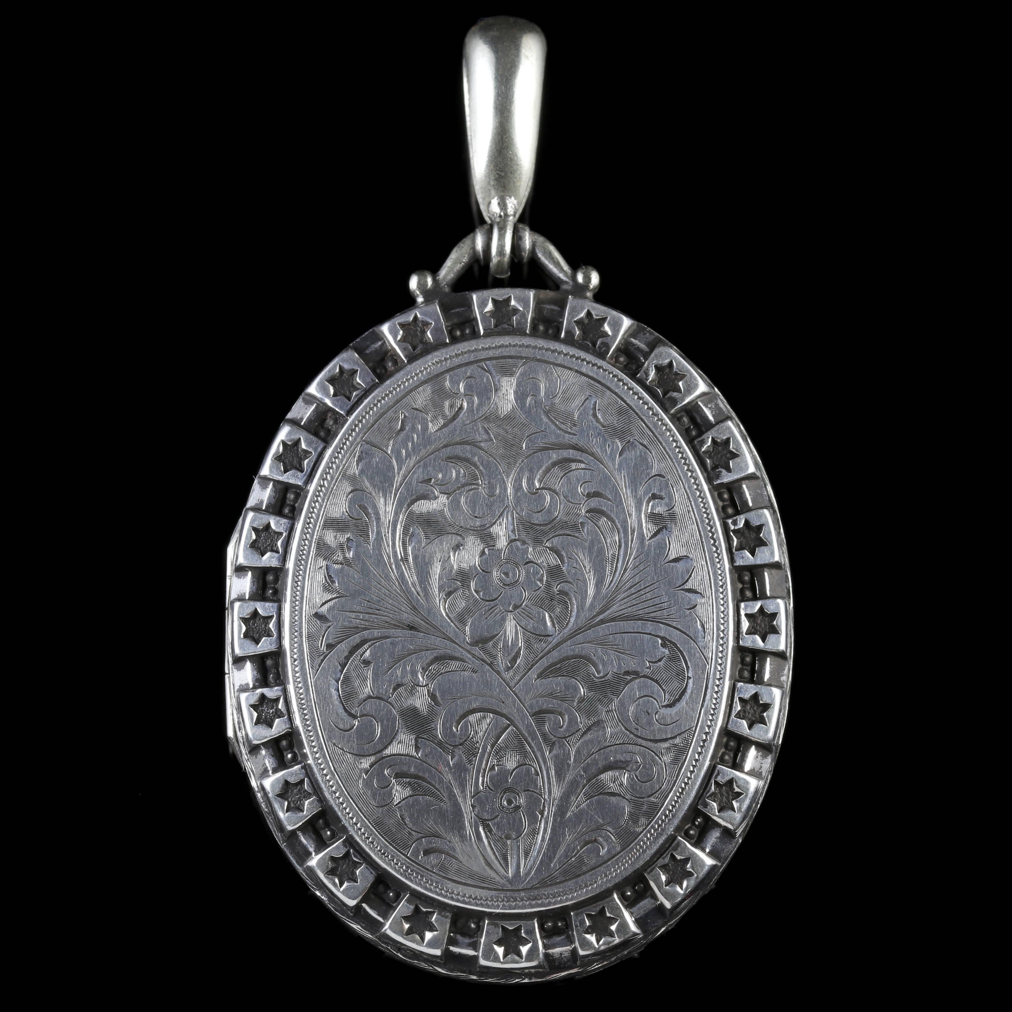 This wonderful Sterling Silver Victorian Collar and Locket is Circa 1880. 

Each link of the Collar boasts beautiful floral engravings leading to a lovely large locket.

The locket is double sided with lovely Victorian engraving on both sides