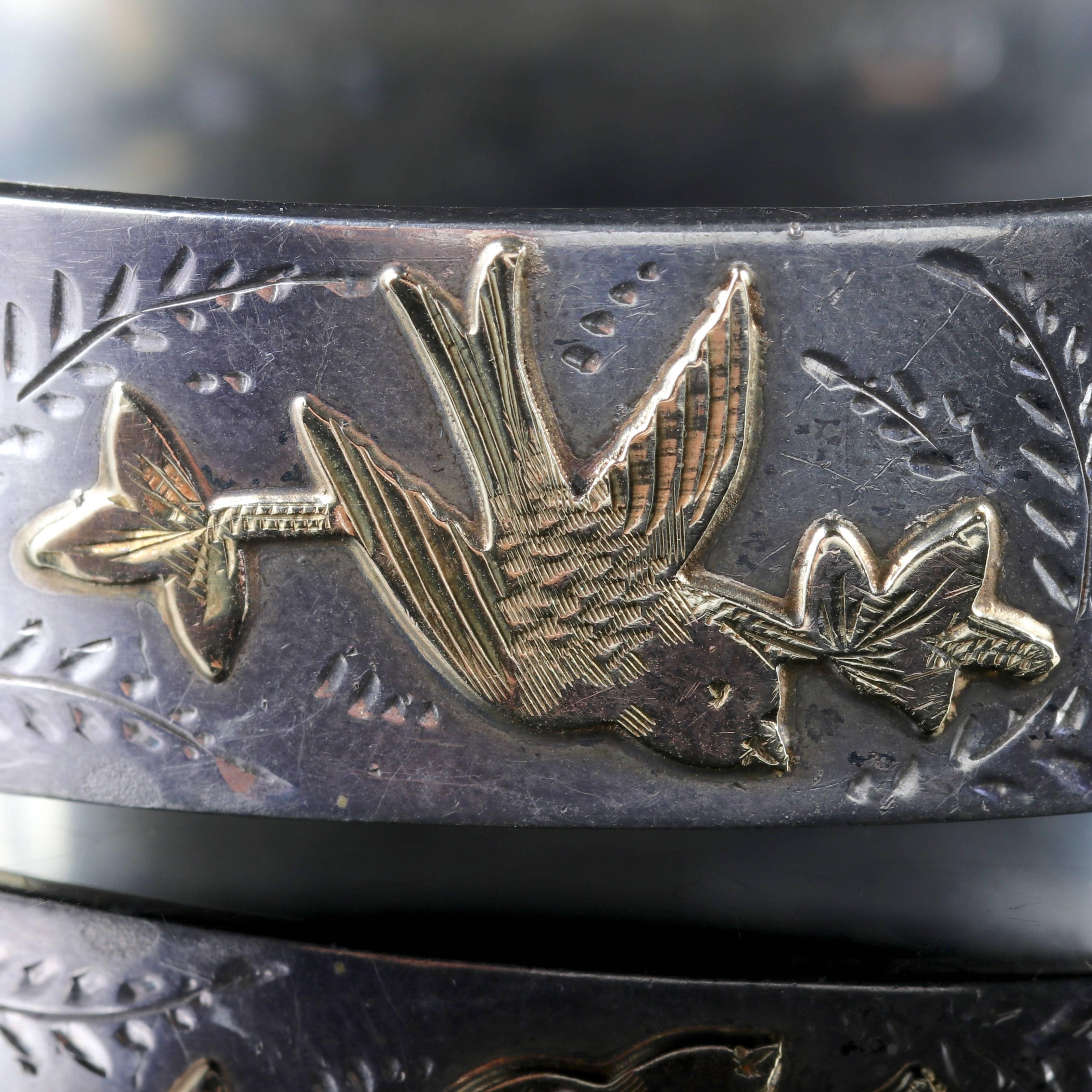 To read more please click continue reading below-

This fabulous Antique Silver and 18ct Gold bangle is genuine Victorian, Circa 1880.

Three Gold birds are set across the top gallery of the bangle, they are beautifully decorated and carry a twig