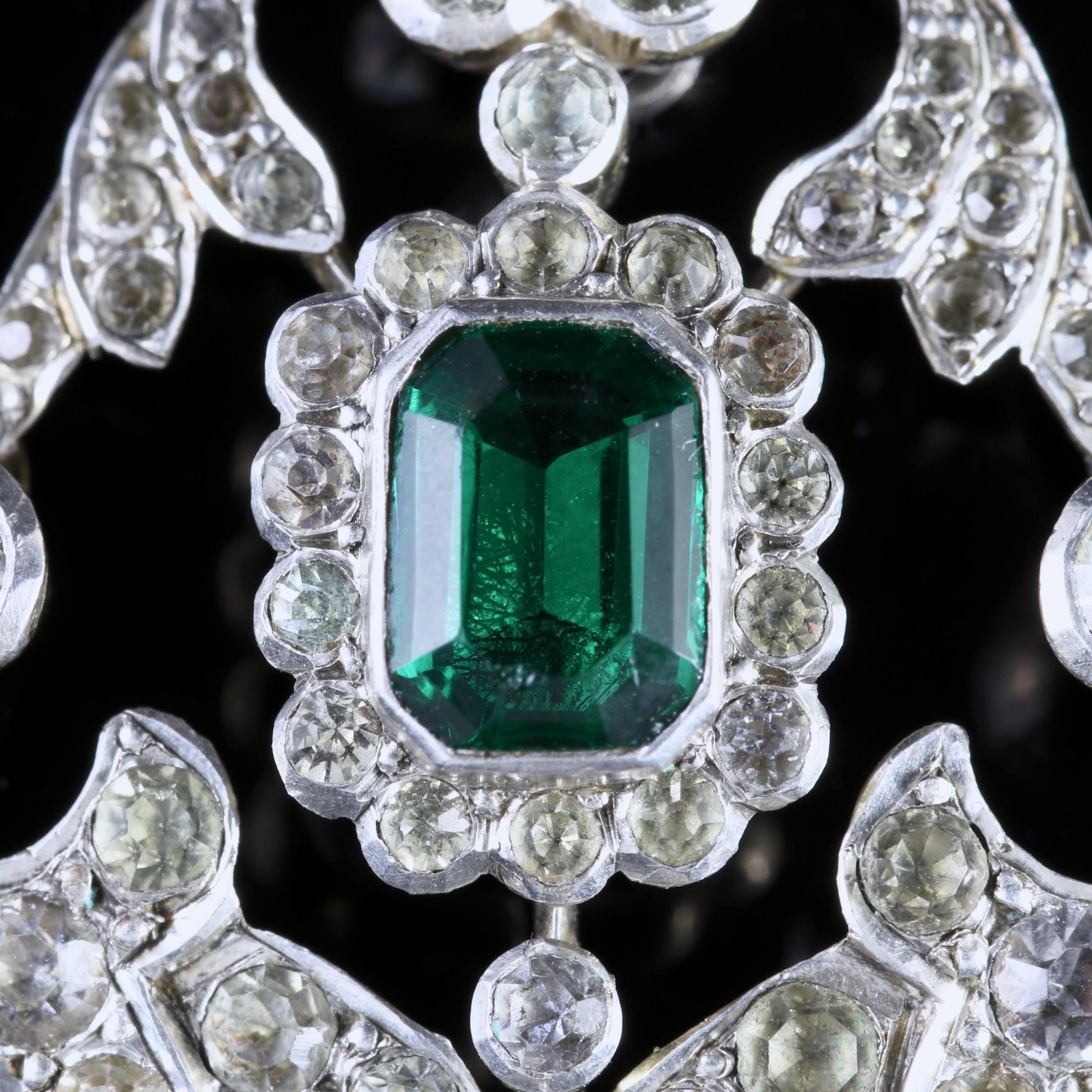 To read more please click continue reading below-

This stunning antique Sterling Silver Paste pendant is genuine Victorian, Circa 1900. 

The pendant is set with a beautiful Emerald green Paste Stone in the centre and surrounded by sparkling white