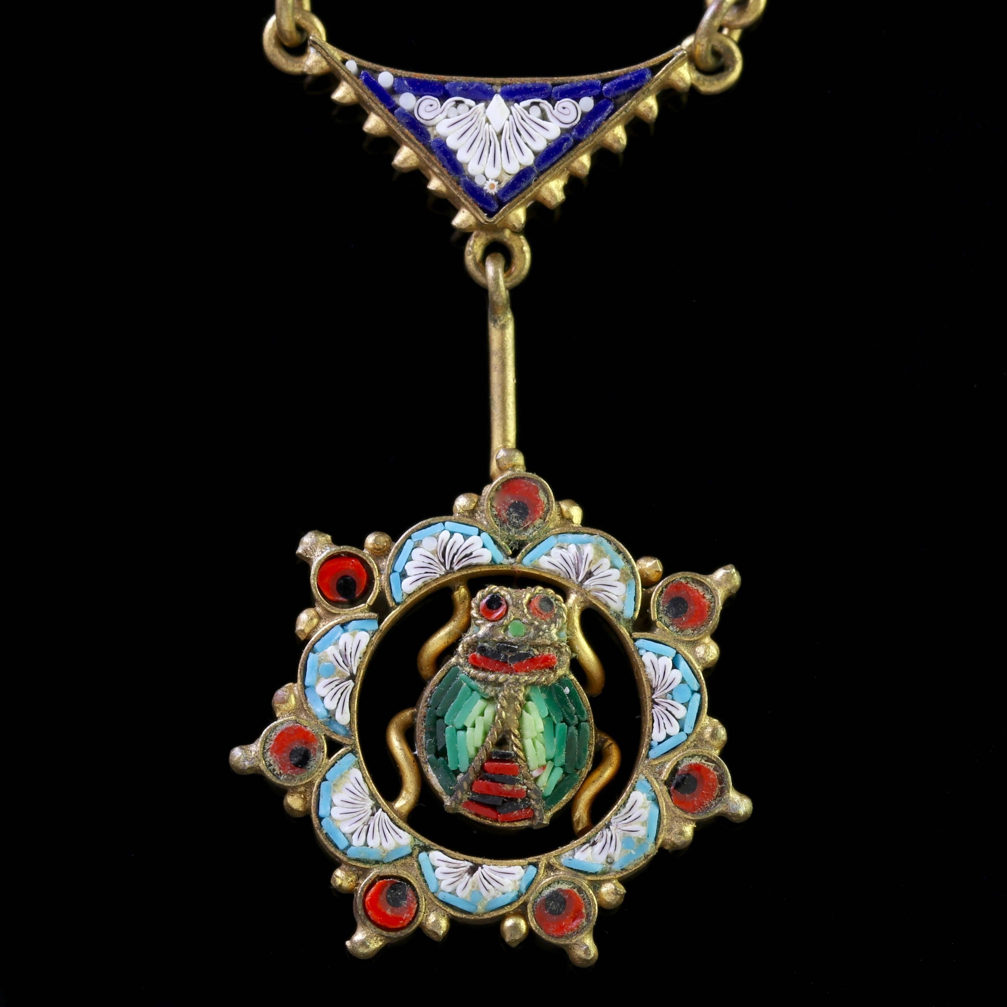 To read more please click continue reading below-

This fabulous antique Micro Mosaic necklace is genuine Victorian, Circa 1860.

The necklace boasts colourful floral Mosaic tile work leading to a large central beetle dropper. 

The central beetle