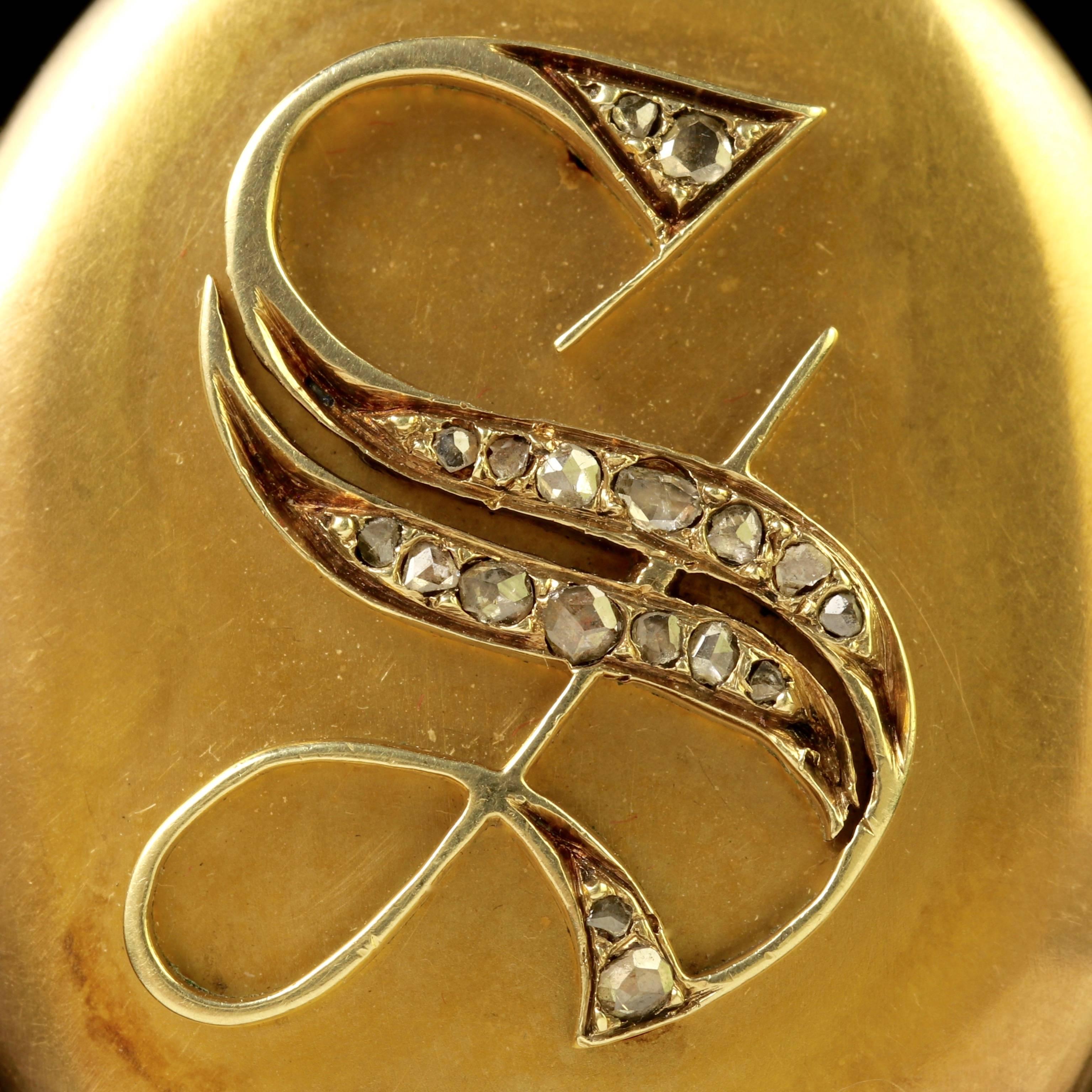To read more please click continue reading below-

This fabulous antique 18ct Yellow Gold Victorian locket and chain is Circa 1900.

Old rose cut Diamonds adorn the initial ’ S ’ which is displayed in the centre of the locket. 

A rose cut Diamond