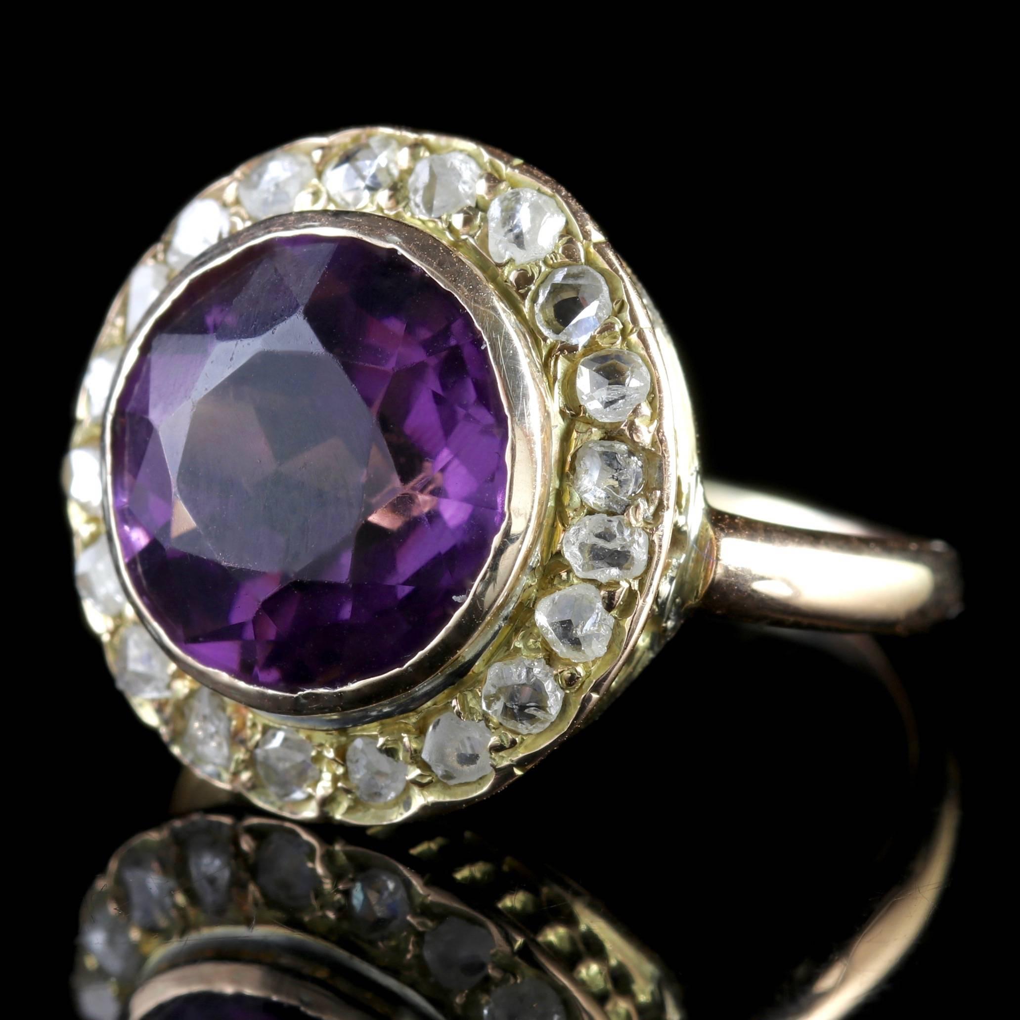 To read more please click continue reading below-

This genuine antique Victorian 18ct Yellow Gold ring boasts a 5ct natural Amethyst in the centre surrounded by a halo of Diamonds.

Amethyst has been highly esteemed throughout the ages for its