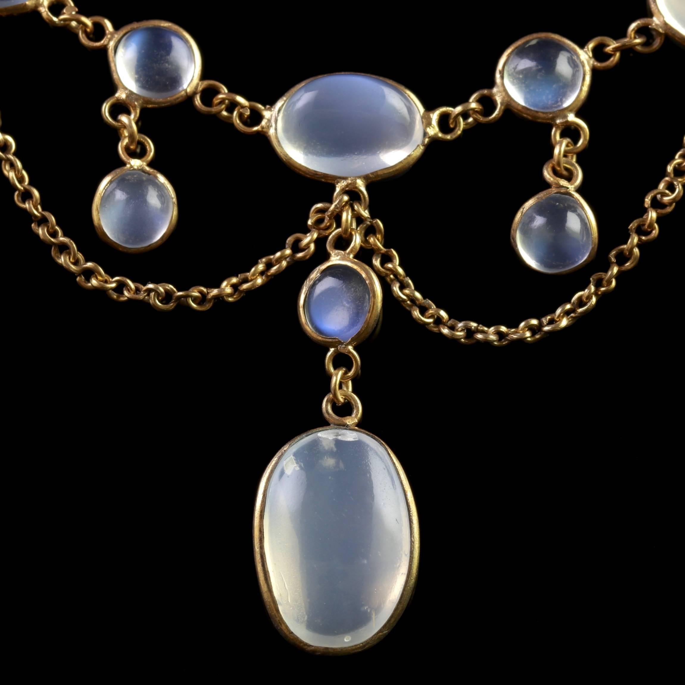 To read more please click continue reading below-

This genuine antique Victorian Moonstone necklace is set in 18ct Yellow Gold on Silver, Circa 1900.

A lovely fringe of ghostly Moonstones are set into a garland display leading to a large Moonstone