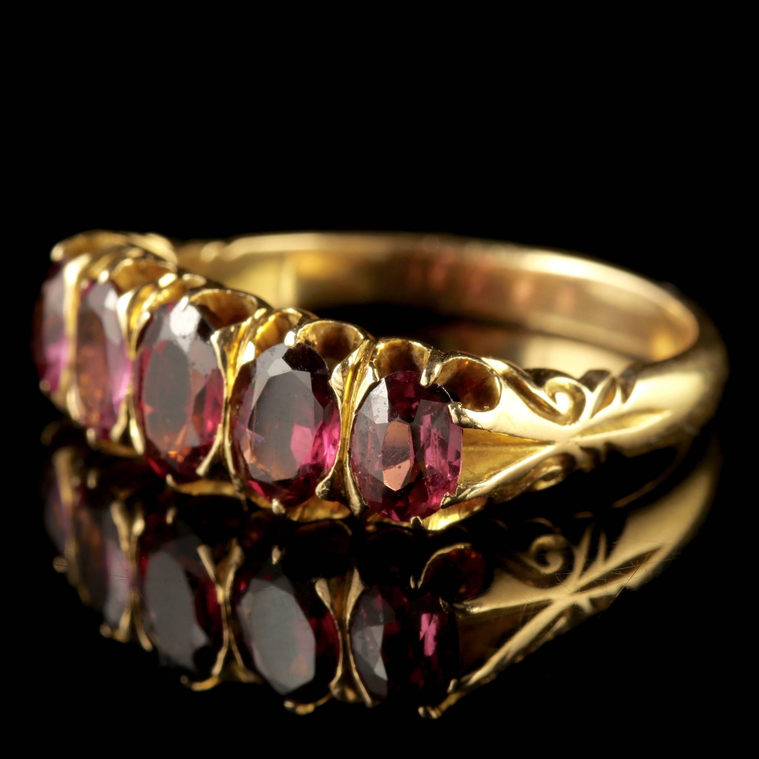 To read more please click continue reading below-

This fabulous Victorian antique five stone Almandine Garnet ring is set in 18ct Yellow Gold, Circa 1900.

Five beautiful Almandine Garnet’s adorn the face of the ring with flashes of Amethyst and