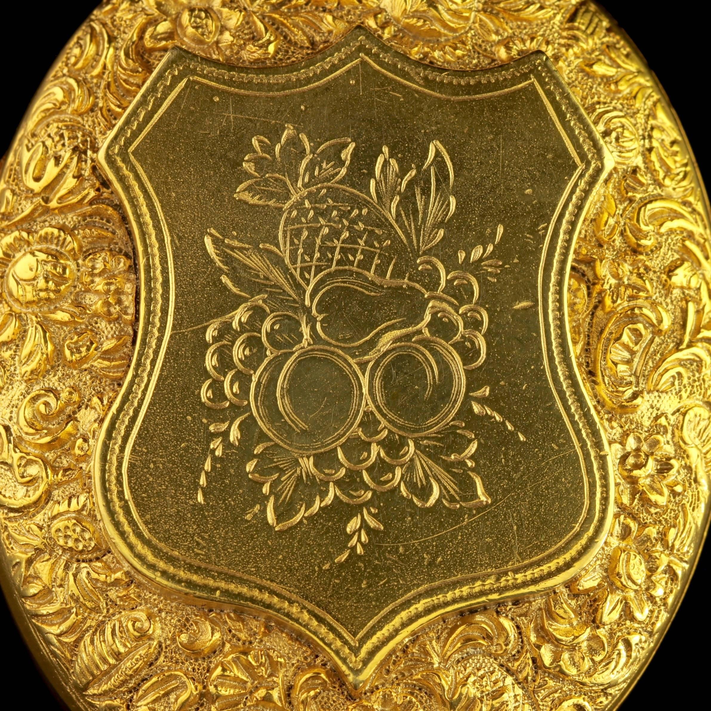 To read more please click continue reading below-

This genuine antique Victorian Fruit locket is set in Sterling Silver and gilded in 18ct Yellow Gold, Circa 1880.

The central piece depicts a lovely engraved fruit display of apples, grapes pears