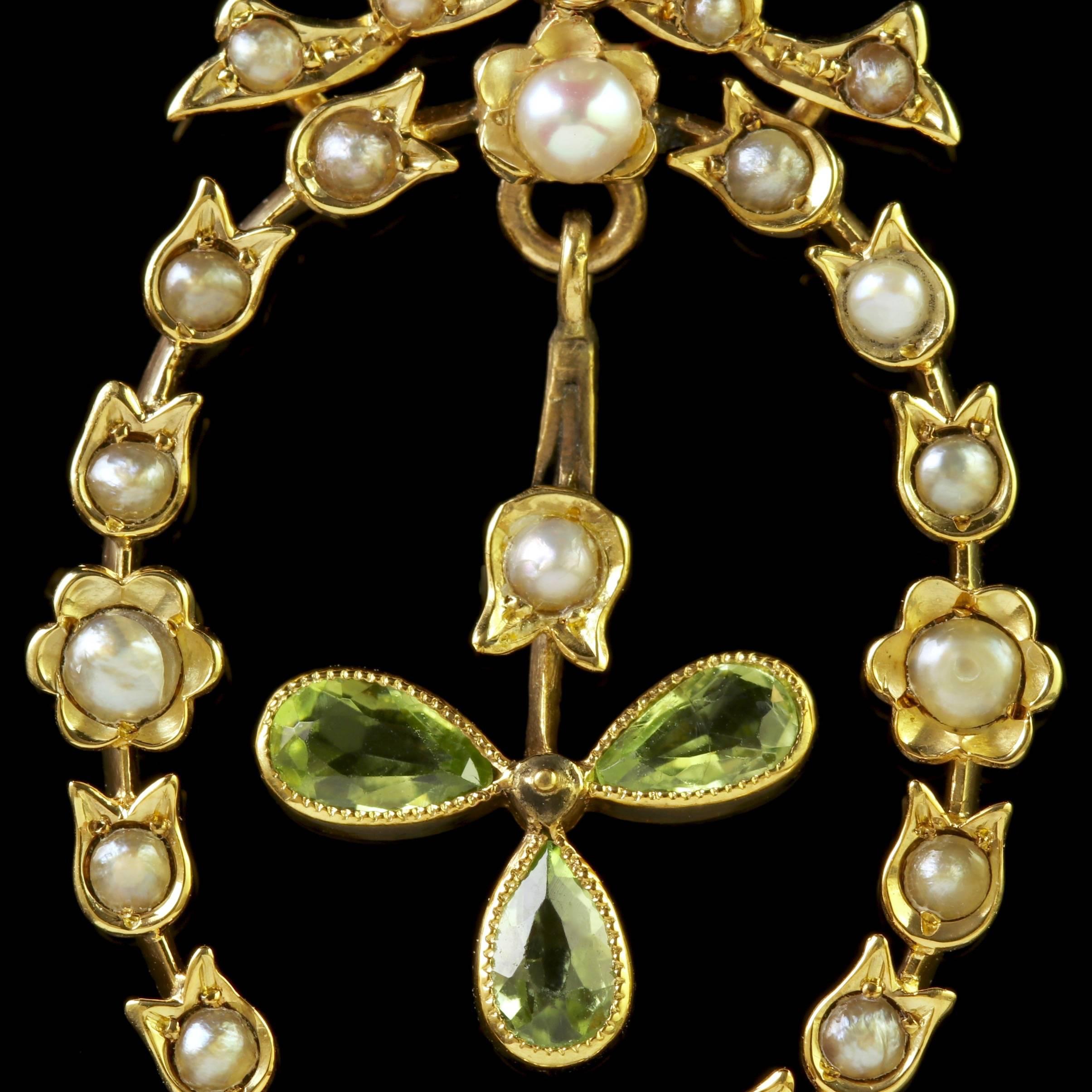 To read more please click continue reading below-

This fabulous antique 18ct Gold Peridot and Pearl pendant is genuine Edwardian Circa 1915.

The wonderful pendant is decorated in lovely Pearls and boasts a beautiful swinging dropper in the centre