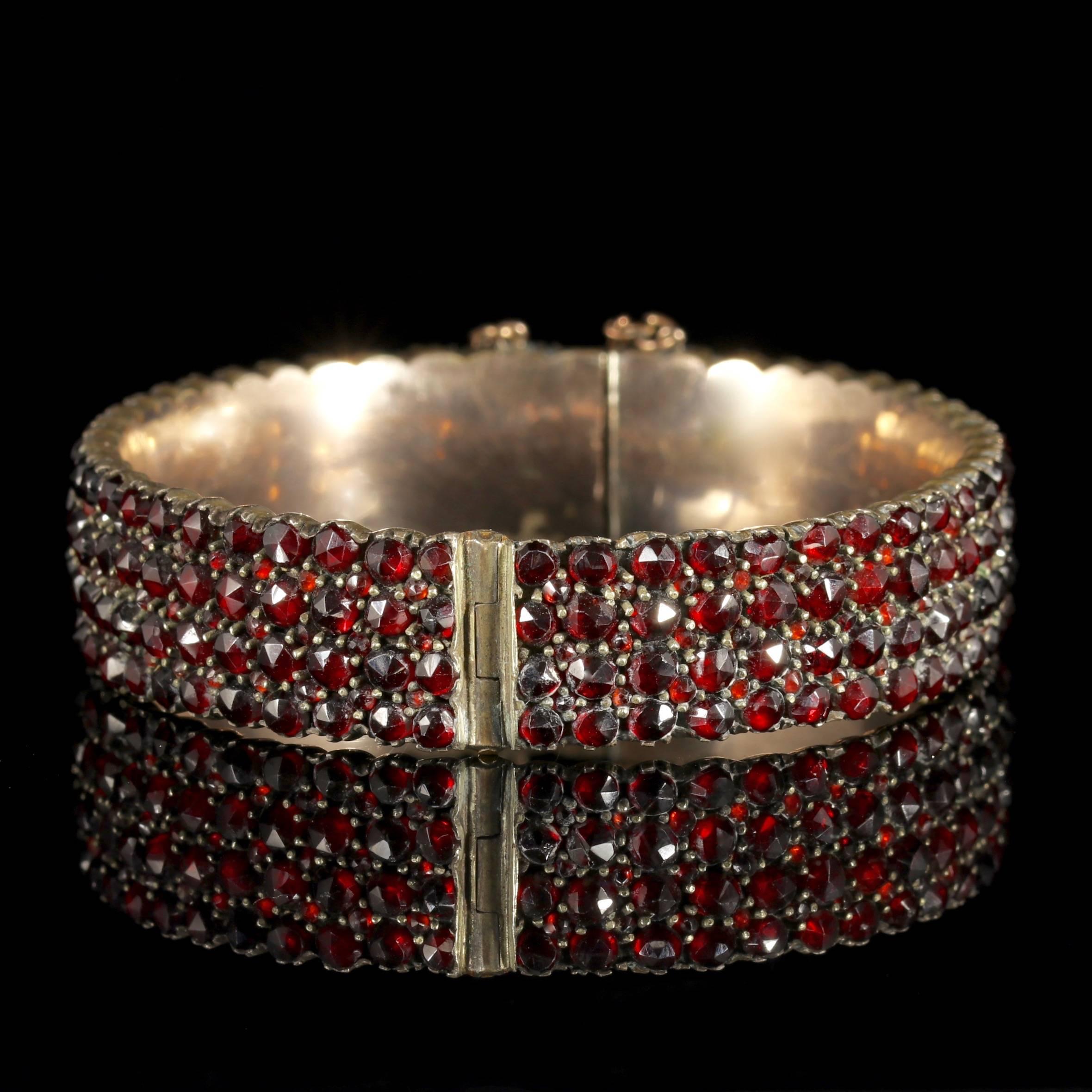 To read more please click continue reading below-

This fabulous antique Bohemian Garnet Gold bangle is genuine Victorian Circa 1900. 

The beautiful bangle is encrusted with deep red Bohemian Garnet’s sparkling around the entire circumference of