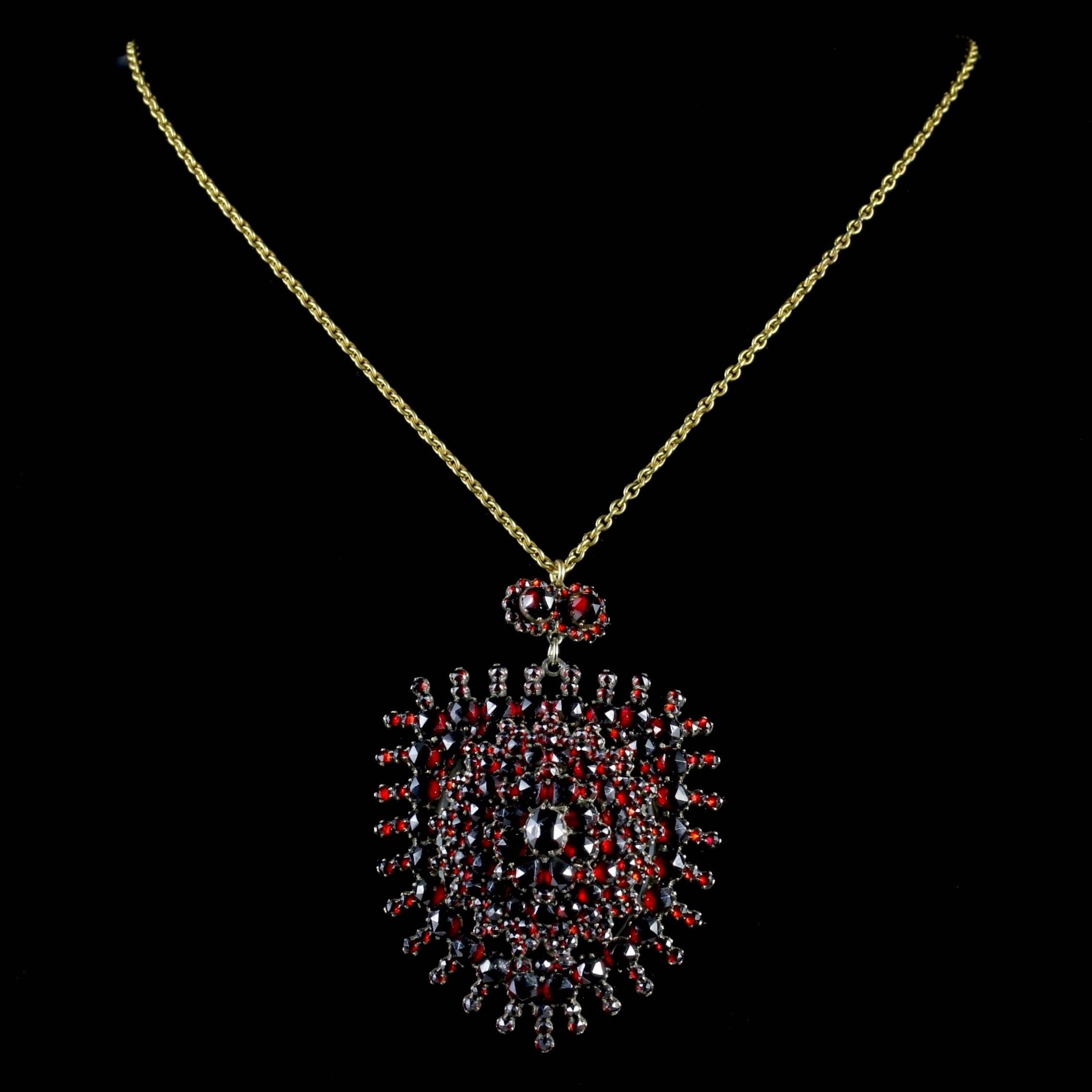 To read more please click continue reading below-

This magnificent antique Bohemian Garnet pendant Locket and chain is genuine Victorian Circa 1890.

The beautiful large pendant is adorned with a stack of deep red Bohemian Garnet’s set in a