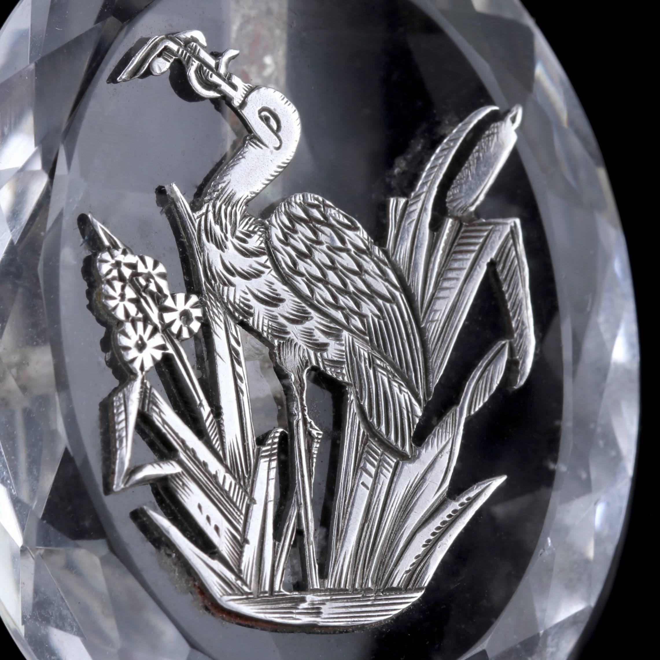 To read more please click continue reading below-

This magnificent antique Rock Crystal Pendant and Sterling Silver chain is genuine Victorian Circa 1900. 

The fabulous Clear Rock Crystal is beautifully cut displaying an engraved Silver Stork