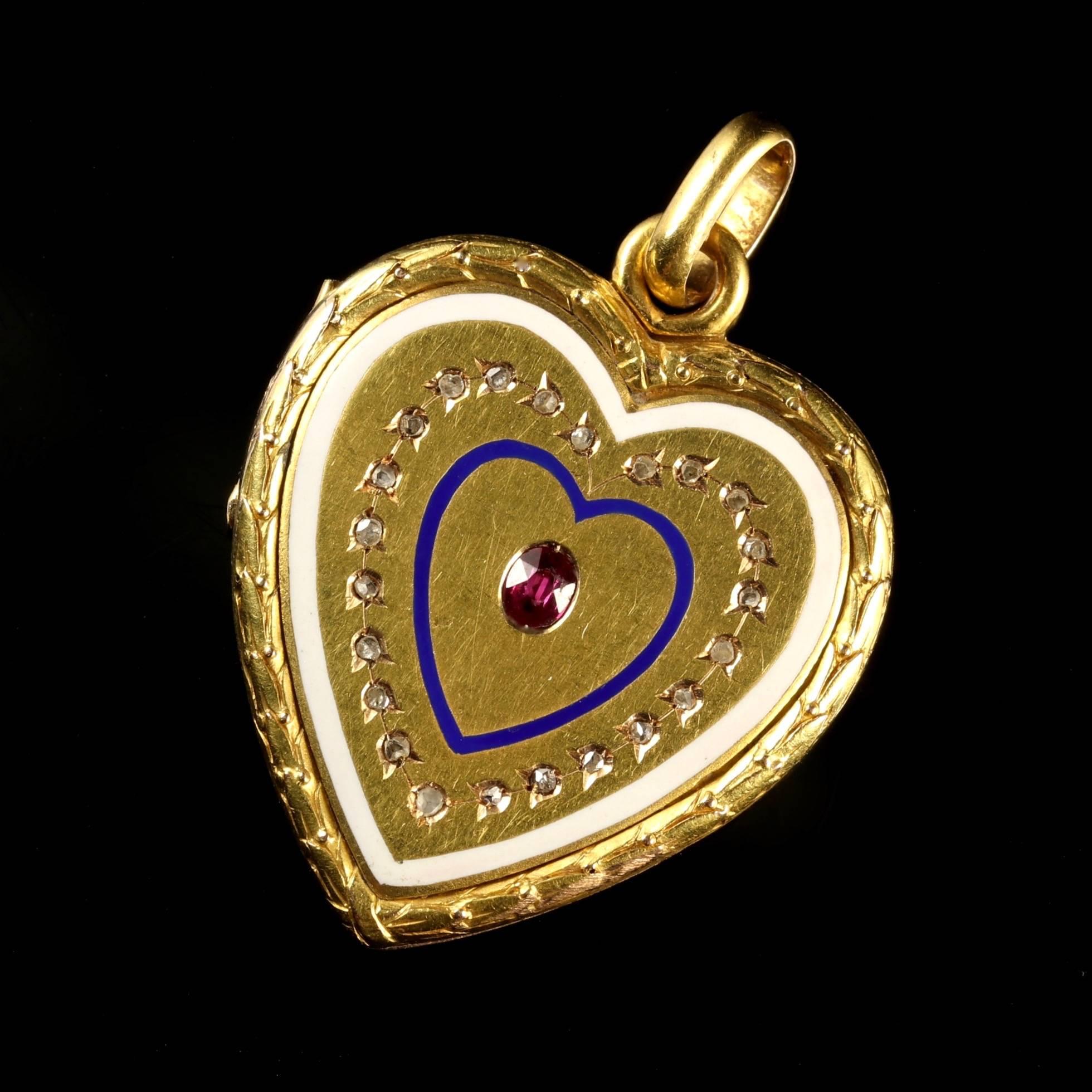 This fabulous Georgian 18ct Yellow Gold heart locket pendant is Circa 1830.

Set with a central Ruby, which is surrounded by a lovely blue Enamel heart, which has a halo of Diamonds that are encrusted into the gallery of the locket, finishing with