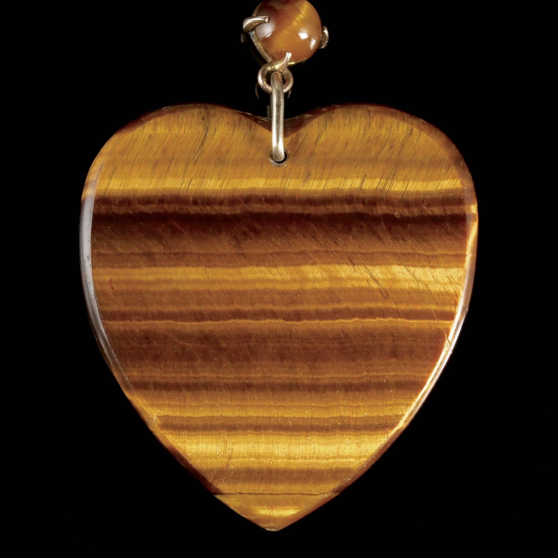 To read more please click continue reading below-

This magnificent antique Victorian 9ct Gold Tiger’s Eye heart pendant necklace is Circa 1900. 

The beautiful necklace is adorned with stunning Tiger’s Eye stones leading to a fabulous Citrine and