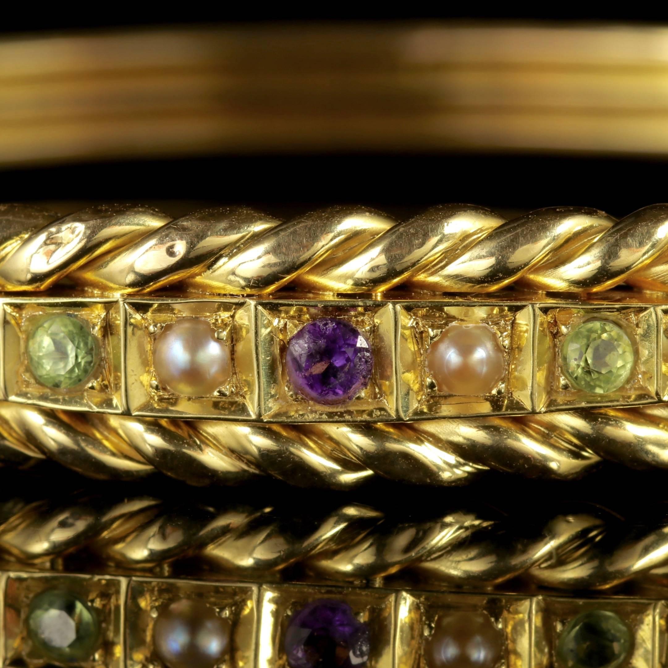 To read more please click continue reading below-

This fabulous antique Victorian 18ct Yellow Gold Suffragette bangle is Circa 1900. 

Suffragettes liked to be depicted as feminine, their jewellery popularly consisted of Violet Green and White