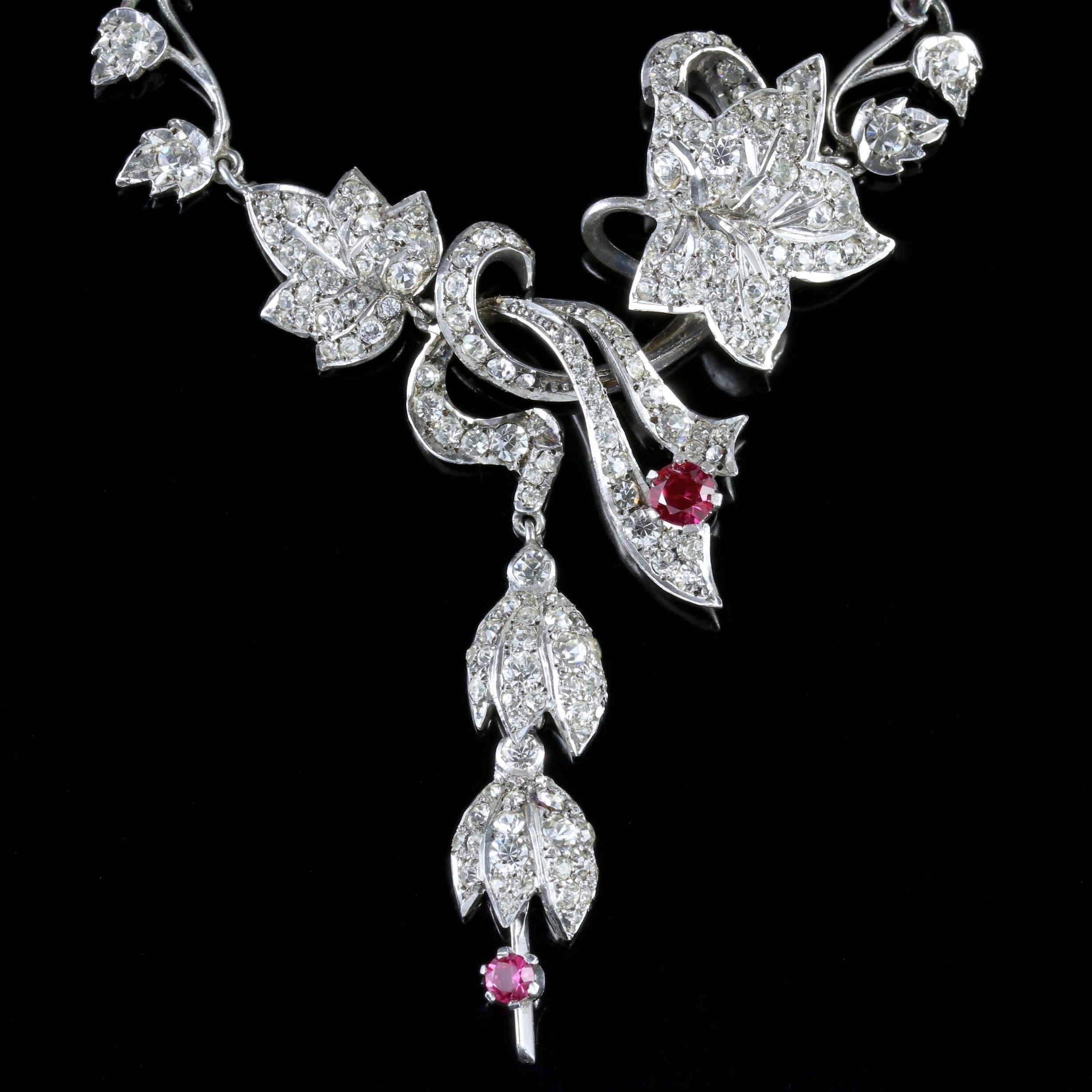 To read more please click continue reading below-

This stunning Art Deco Sterling Silver Ruby and Paste lavaliere drop necklace is Circa 1920.

Art Deco represents the style of the decorative arts popular between the two wars. The style was huge in