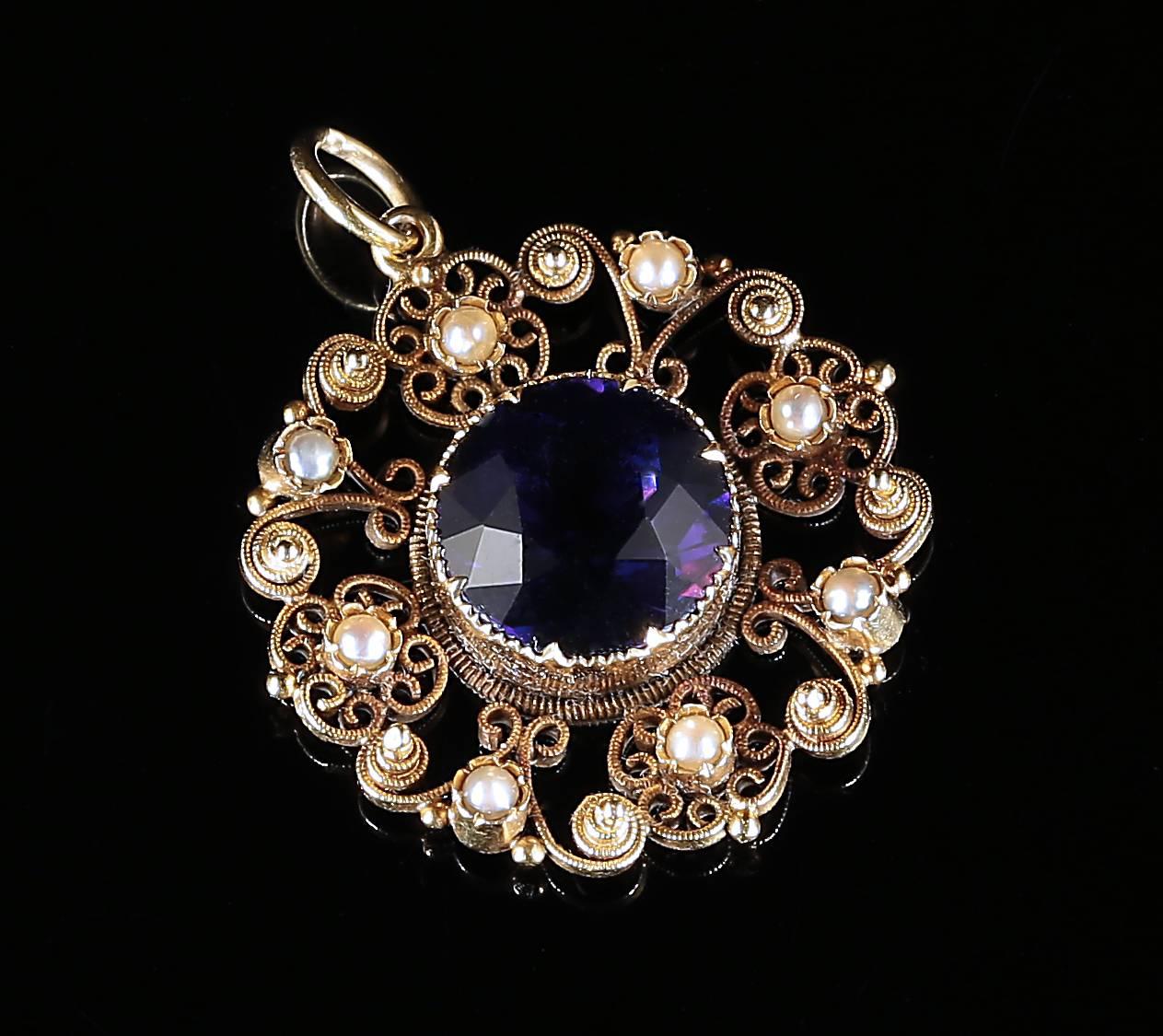 This fabulous 18ct yellow gold genuine Antique Georgian pendant is set with a lovely large Amethyst in the centre and adorned with cannetille workmanship and natural pearls. 

Beautiful all round Georgian detail is set into this fabulous pendant.