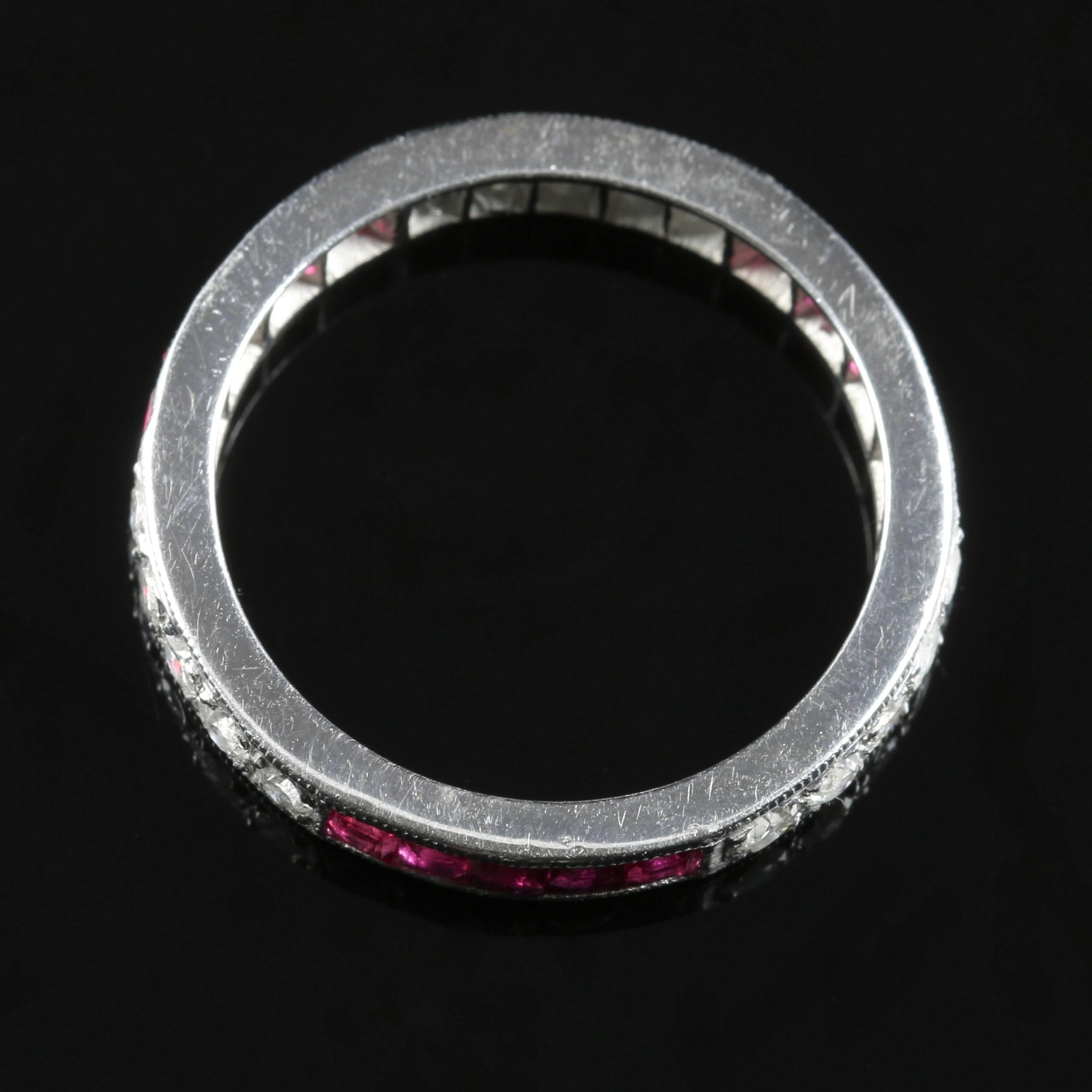 This fabulous full eternity ring is 18ct white gold set with Old Cut Diamonds which are Circa 1900 and French Cut Rubies. 

The lovely old cut Diamonds compliment the fabulous rich pink Rubies making this ring a real statement piece.

The Diamonds