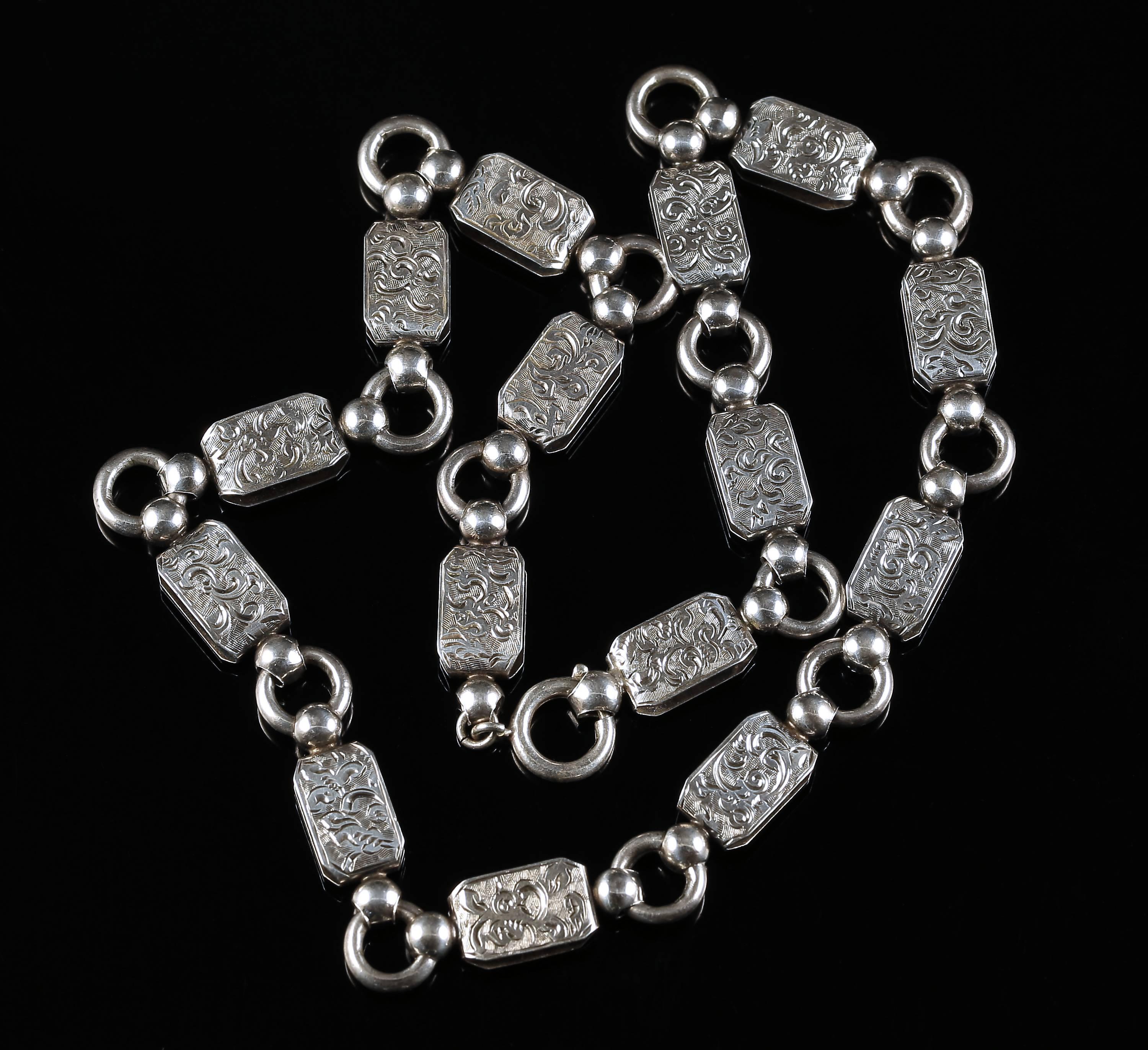 This wonderful sterling silver Victorian Collar / Necklace is beautiful.

Circa 1880

Lovely engraved panels lead to silver round links, this really is beautiful.

Boasts sunning workmanship of its time.

Tested silver with acid tester.

The collar
