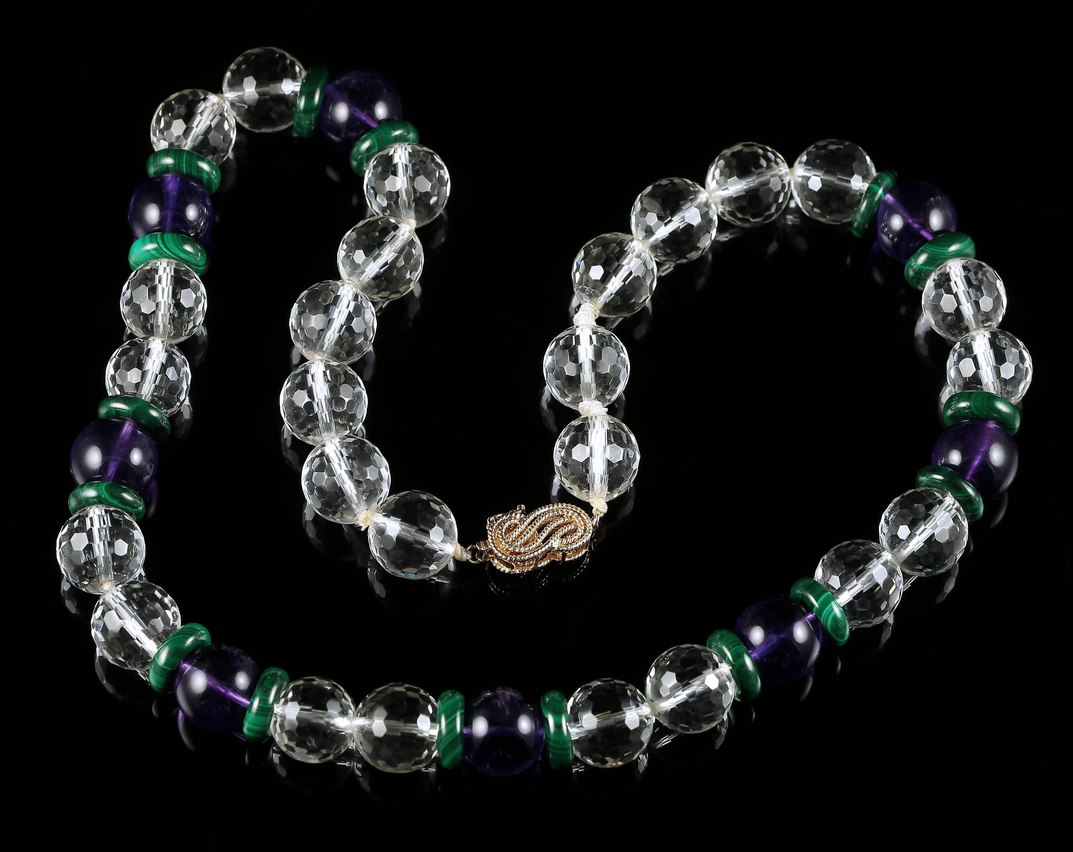This fabulous Antique Suffragette necklace is set with genuine gemstones with a 14ct gold clasp.

The white stones are Rock Crystal the purple is natural Amethyst and the malachite is natural too. 

Leading to a newer 14ct gold clasp, the necklace