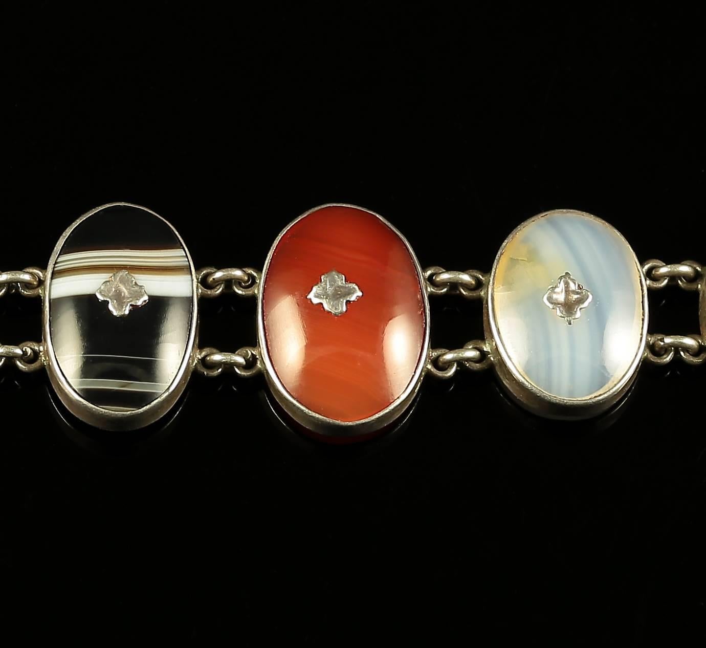 This is a fabulous Sterling silver Scottish Agate bracelet, Circa 1860. 

Set with lots of lovely natural agates in a lovely oval design set with Celtic silver forget me nots 

Scottish Jewellery was made popular by Queen Victoria as it became a