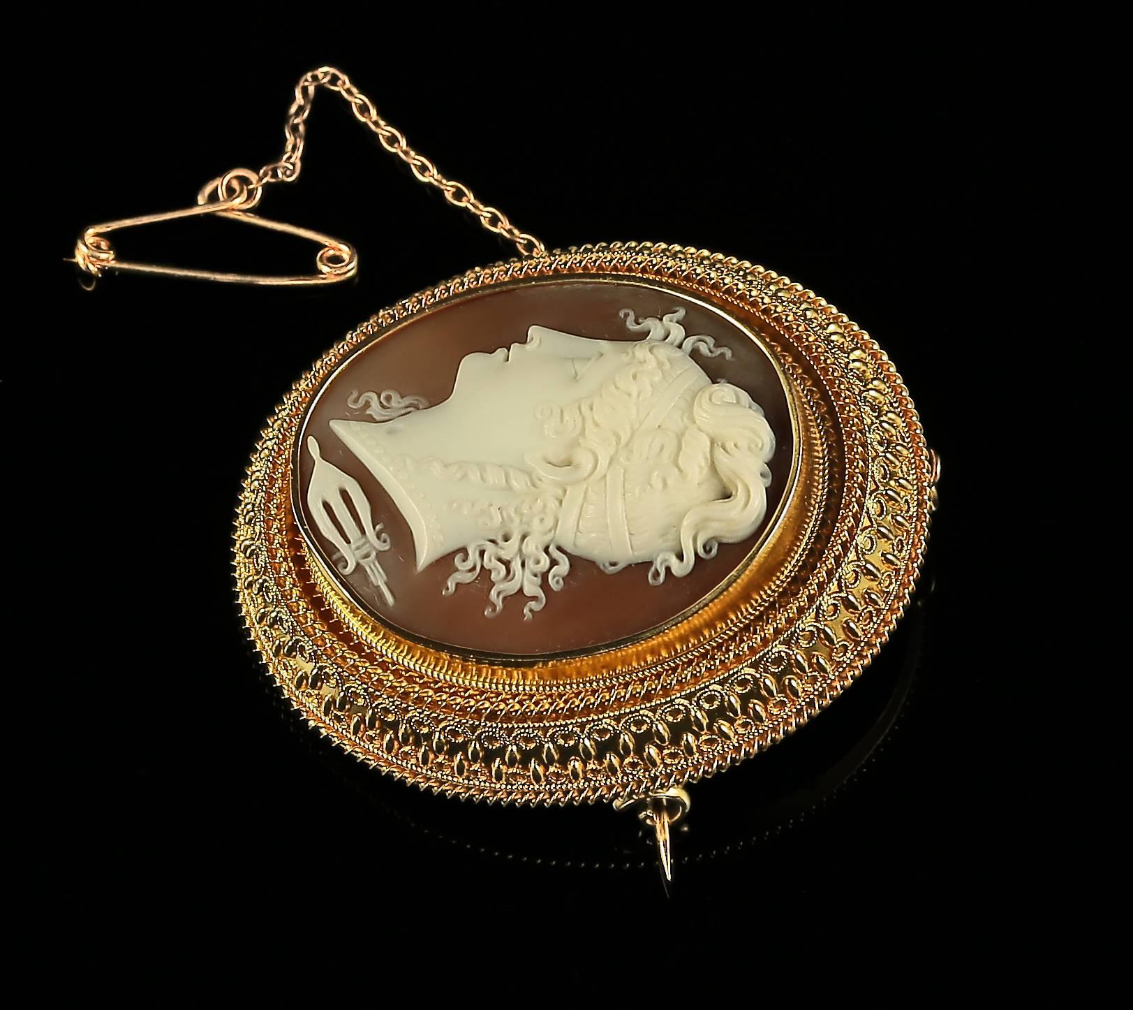 This beautiful Victorian bull mouth shell cameo brooch is steeped in English history. 

This brooch is hand carved from bull mouth shell, very well executed and has developed a lovely smoothness to it with age. 

It is set in a 18ct yellow gold