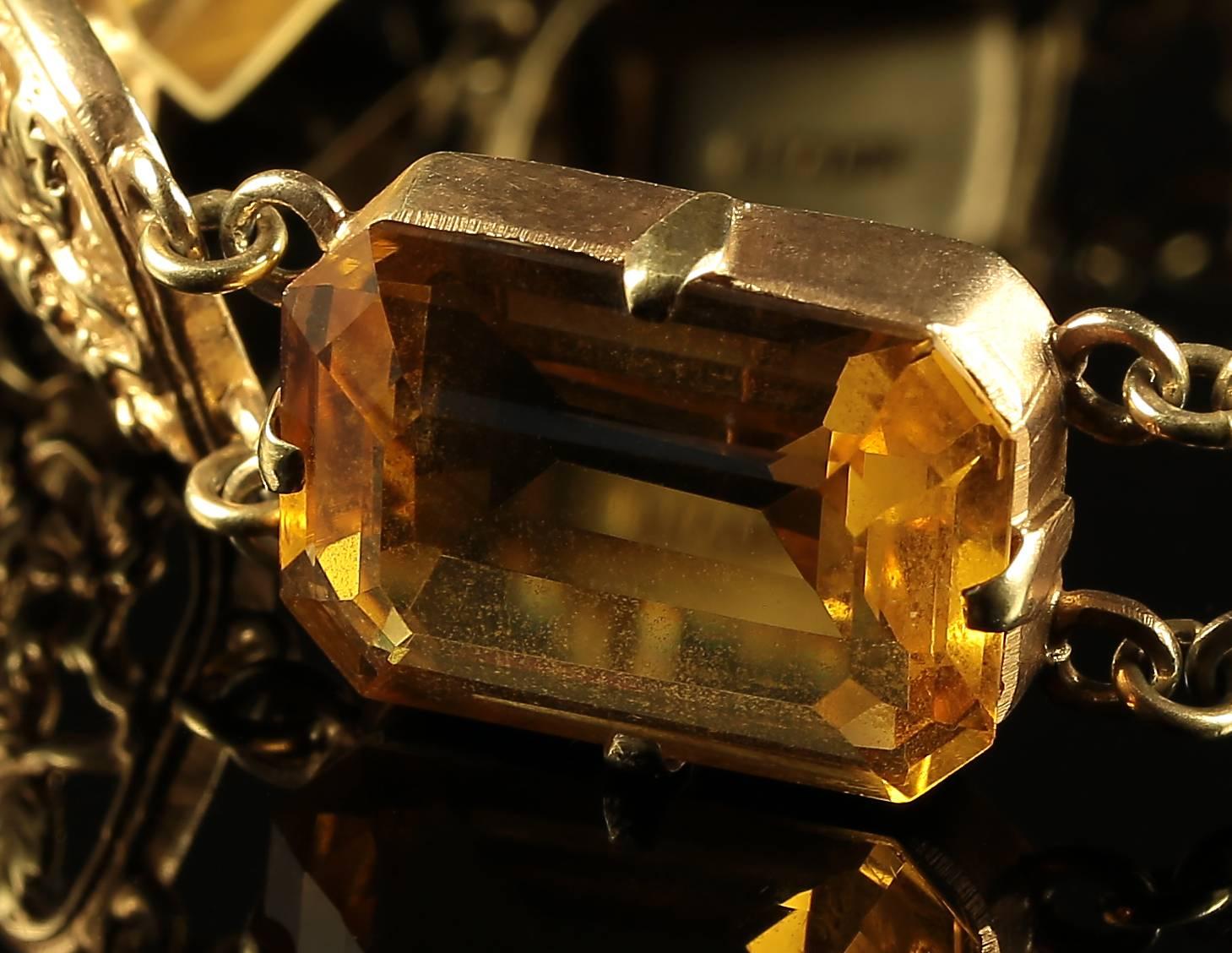 This fabulous Scottish Silver gold bracelet is stunning.

Adorned with lovely Scottish workmanship Circa 1880 and fabulous large Emerald Cut Citrines 

Each Citrine is over 16ct in size   

64ct in total 

The bracelet is silver and gilded in gold.