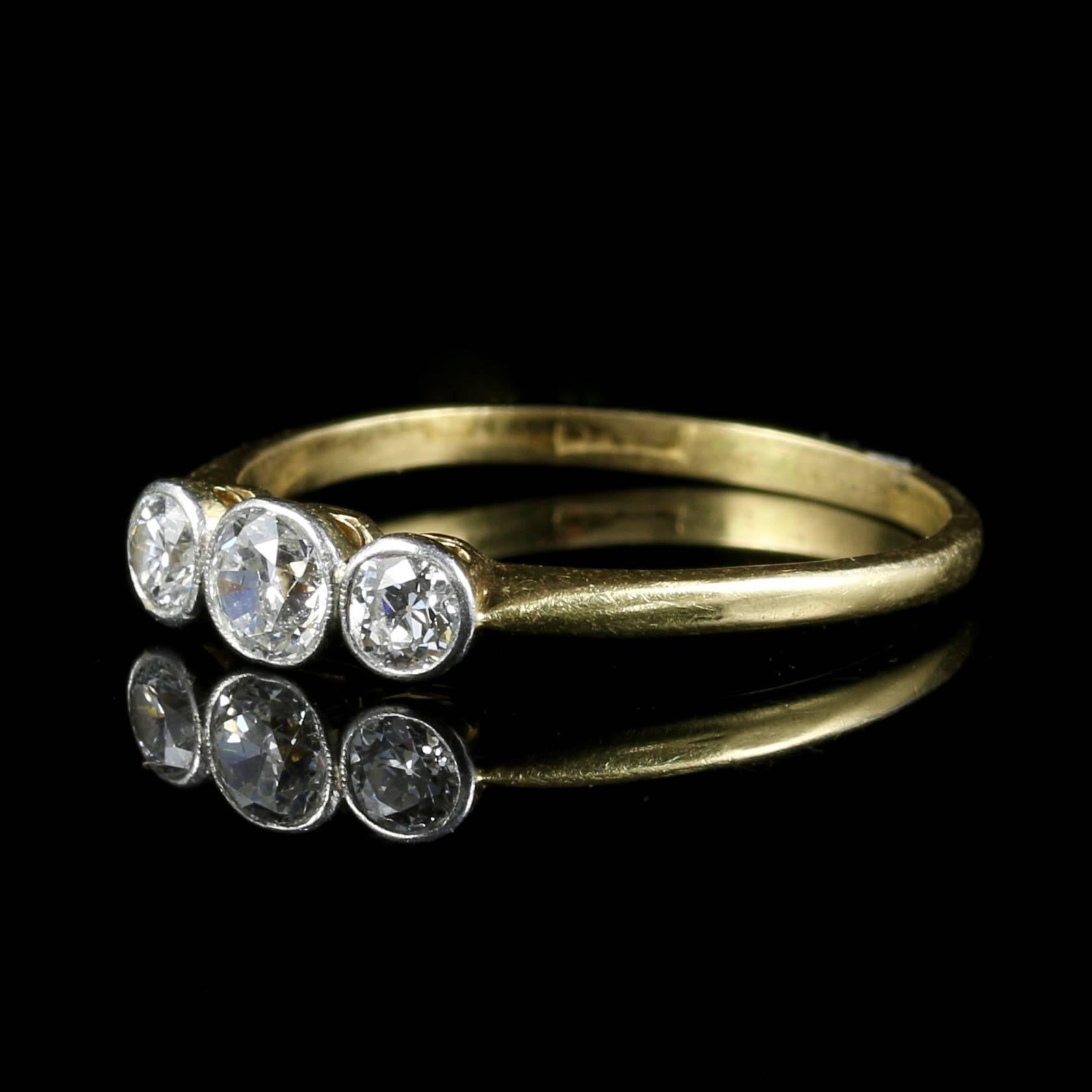 Hallmarked 18ct and pt for platinum.

This ring will make a perfect engagement ring.

The central Diamond is 0.50ct the two outside Diamonds are 0.20ct each, total approx. 0.90ct

The Diamonds are collet set ( no claws ) a beautiful elegant
