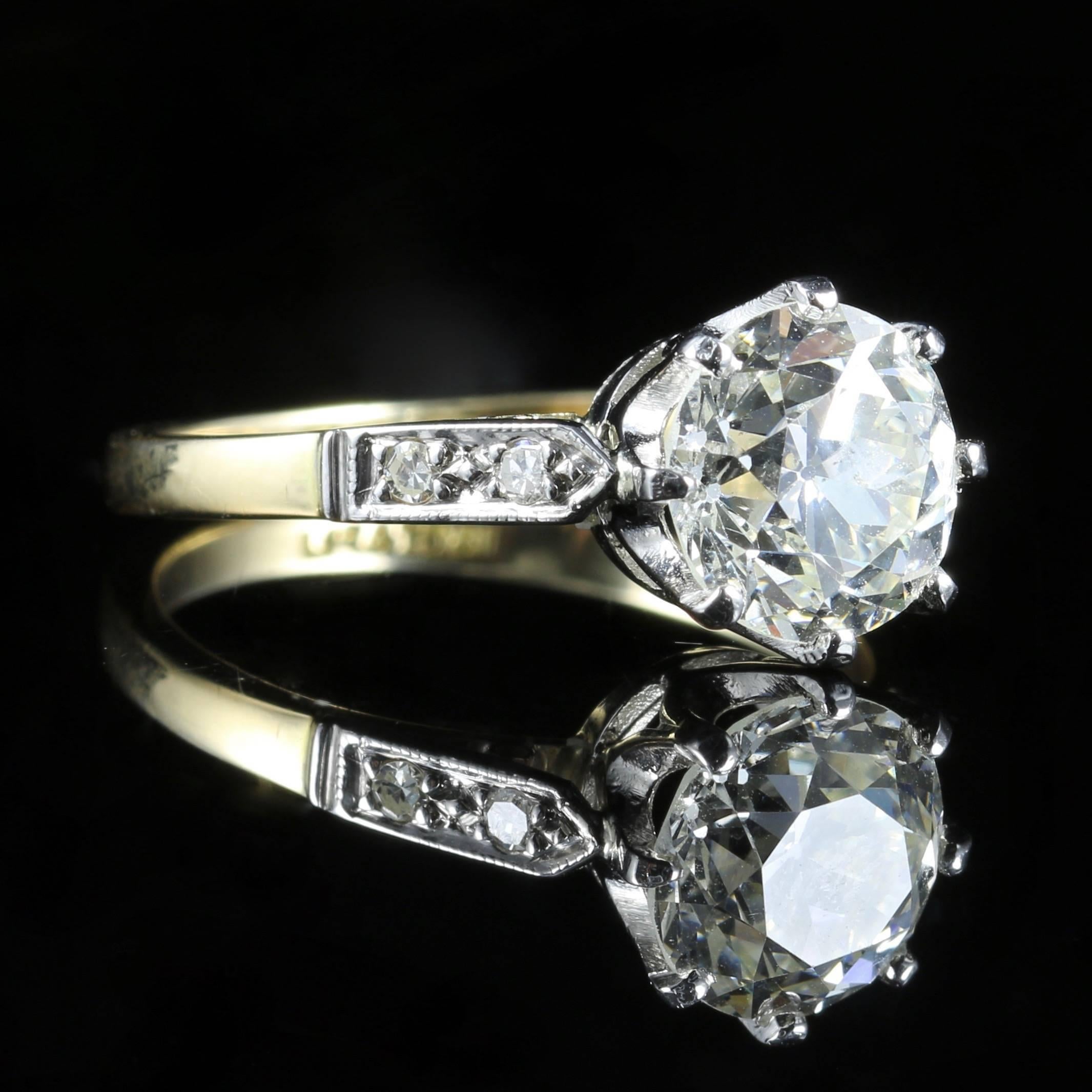 This beautiful Antique Edwardian 18ct yellow gold and platinum ring boasts a stunning 2.03ct Diamond in the centre that has been weighed. 

It is Circa 1915 

An additional 0.10ct of Diamonds sits on each shoulder, giving a total of 2.23ct. 

The