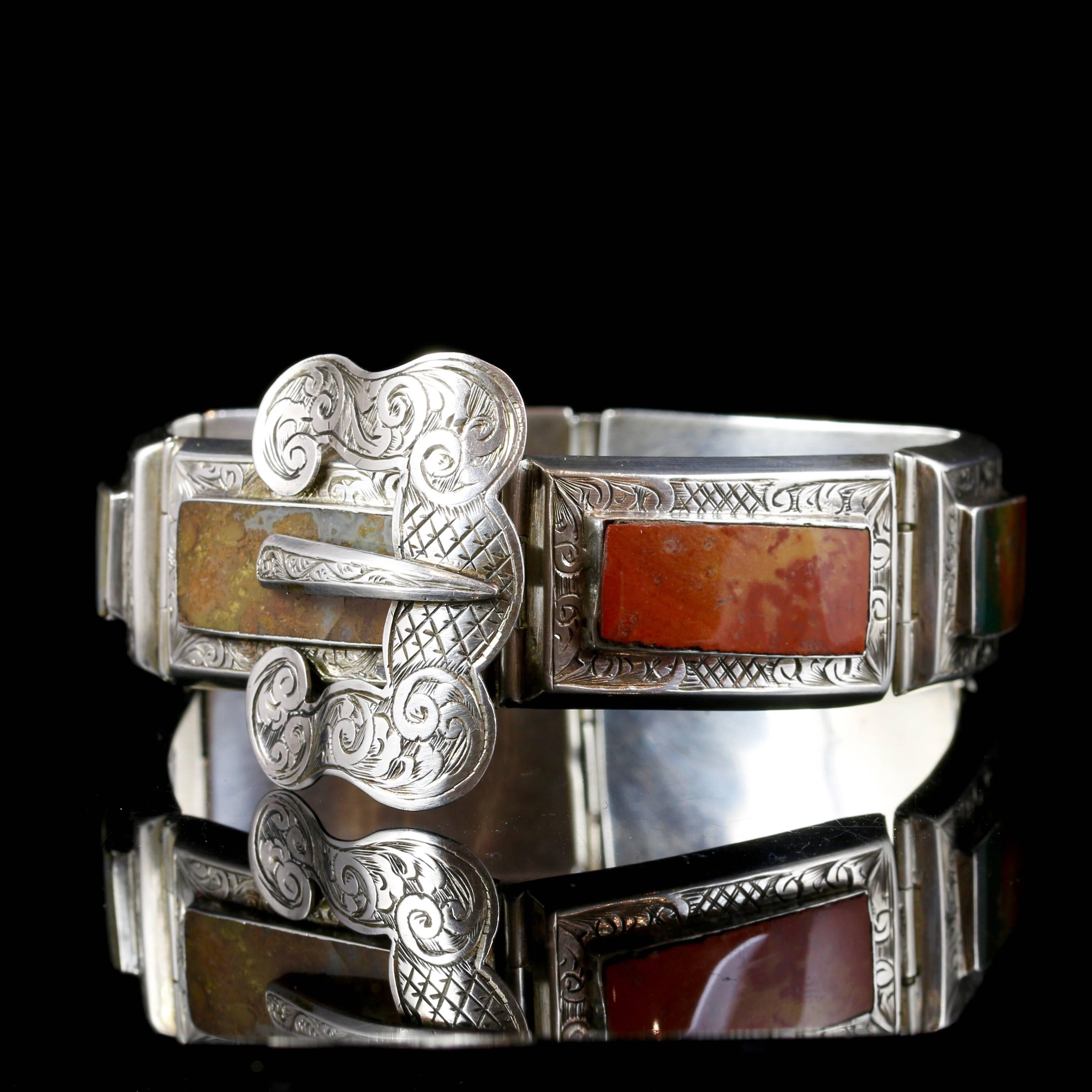 This is a fabulous Sterling silver Scottish Agate bracelet, Circa 1860. 

Set with lots of lovely natural agates in an abstract finish, chased with intricate engraving around each agate.

Scottish Jewellery was made popular by Queen Victoria as it