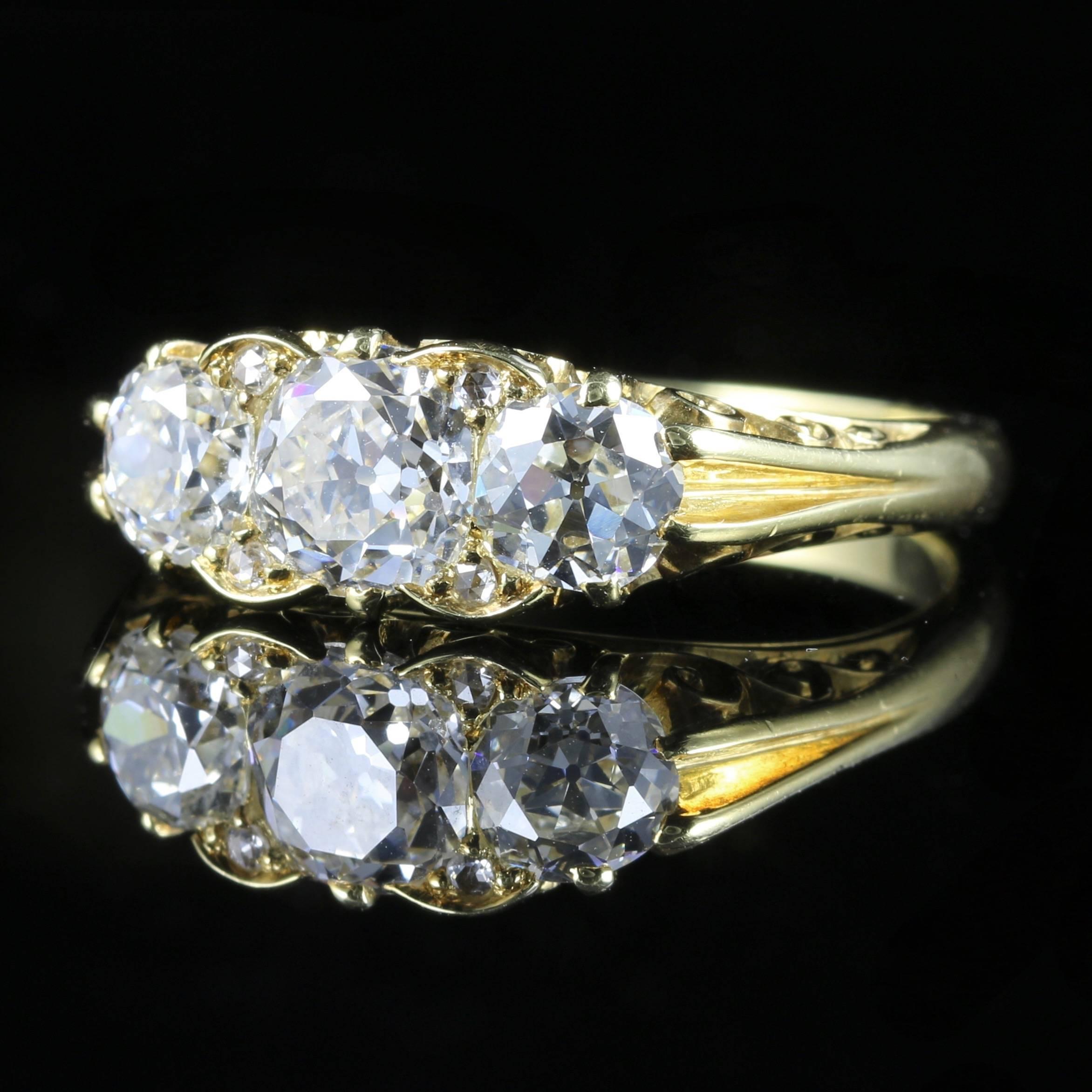 This fabulous 18ct yellow gold ring is genuine Antique Circa 1880. 

Set with 2ct of beautiful Old Cut Diamonds that are SI 1 H Colour. 

Three sparkling diamonds are Circa 1880 and original to the gallery. 

The centre Diamond is 0.80ct with two