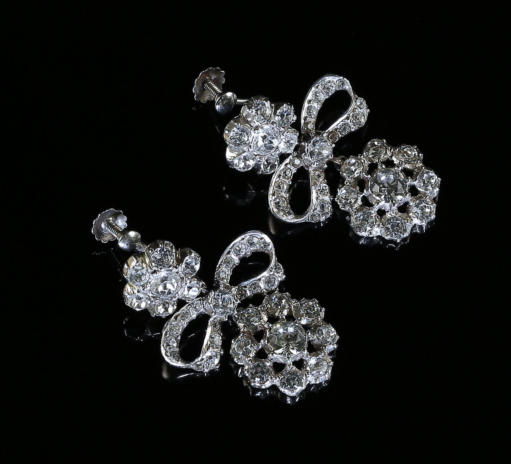 These fabulous Georgian Antique Sterling Silver earrings are set with beautiful Old Cut Paste 

They have superb workmanship and lovely detail from the Georgian Era Steeped in English history and recently purchased in London. 

Hallmarked Sil for