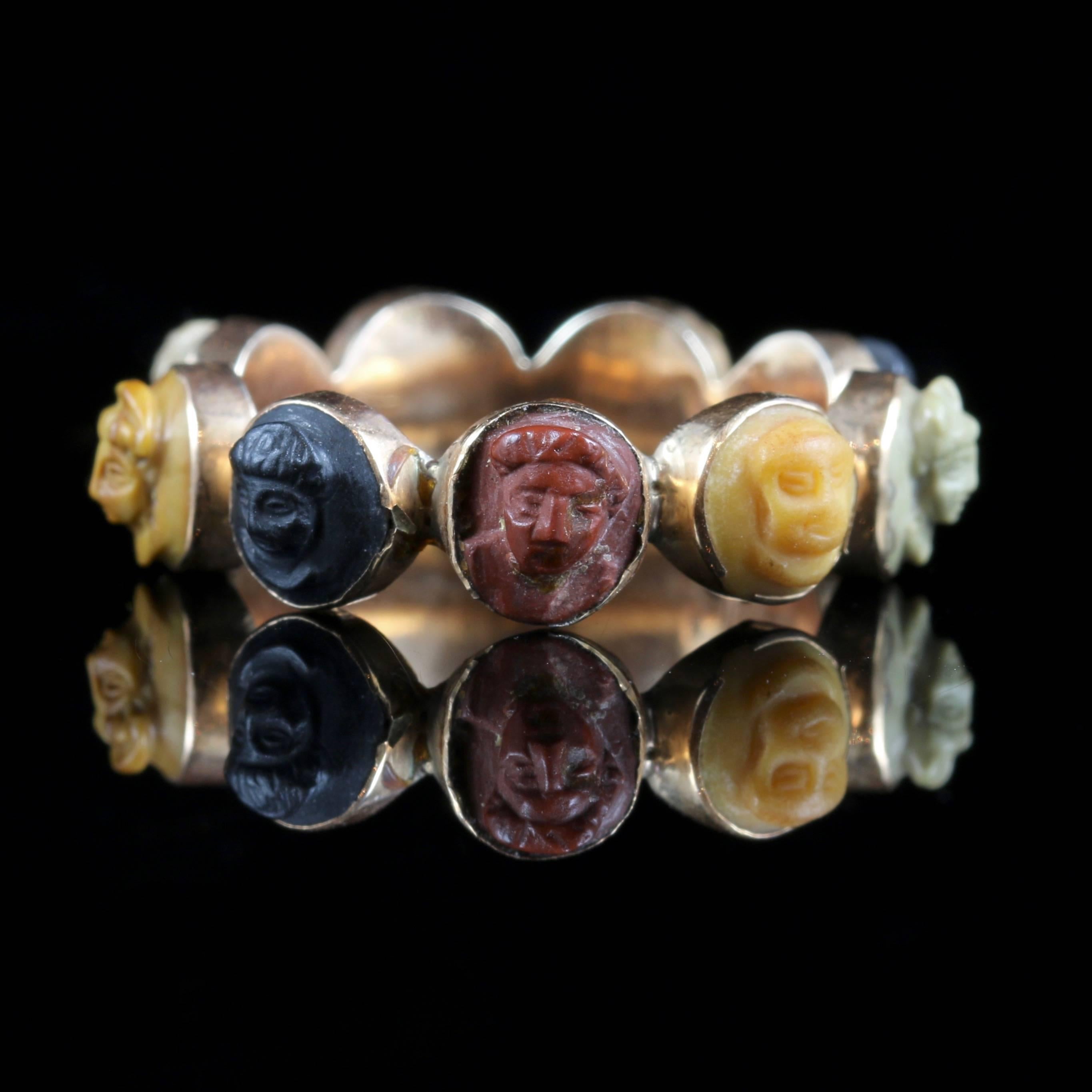 This ring is a very rare find, a beautiful volcanic lava cameo ring which is a full eternity. 

Set in 18ct yellow gold. 

Circa 1800 Nine beautiful cameos which are beautifully carved and very well executed with high relief workmanship. 

The