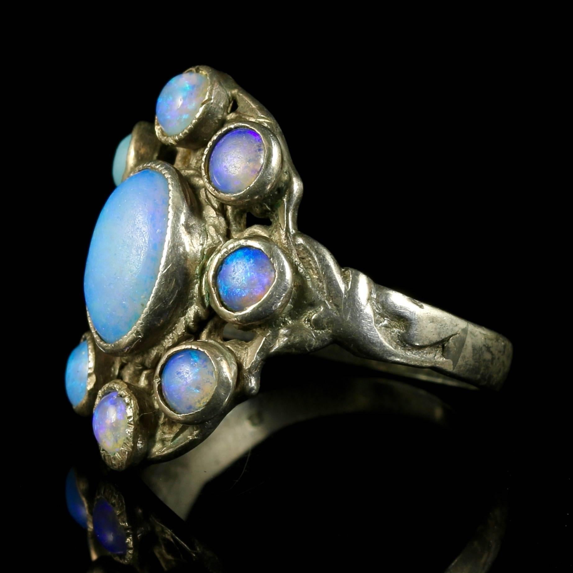 This fabulous Victorian Arts and Crafts sterling silver ring is set with lovely Natural Opals.

The Arts and Crafts Movement began in Britain around 1880 and quickly spread to America, Europe and Japan. 

Inspired by the ideas of John Ruskin and