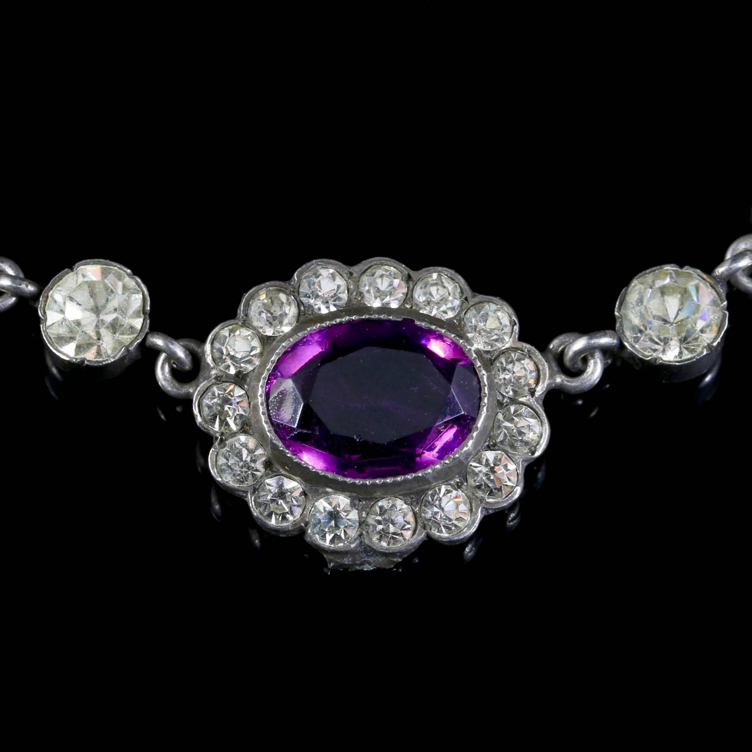This spectacular sterling silver antique amethyst paste necklace is Circa 1915.

The beautiful Edwardian necklace has lovely, deep, rich purple paste stones that are surrounded by white paste stones too. 

Paste is a heavy, very transparent flint