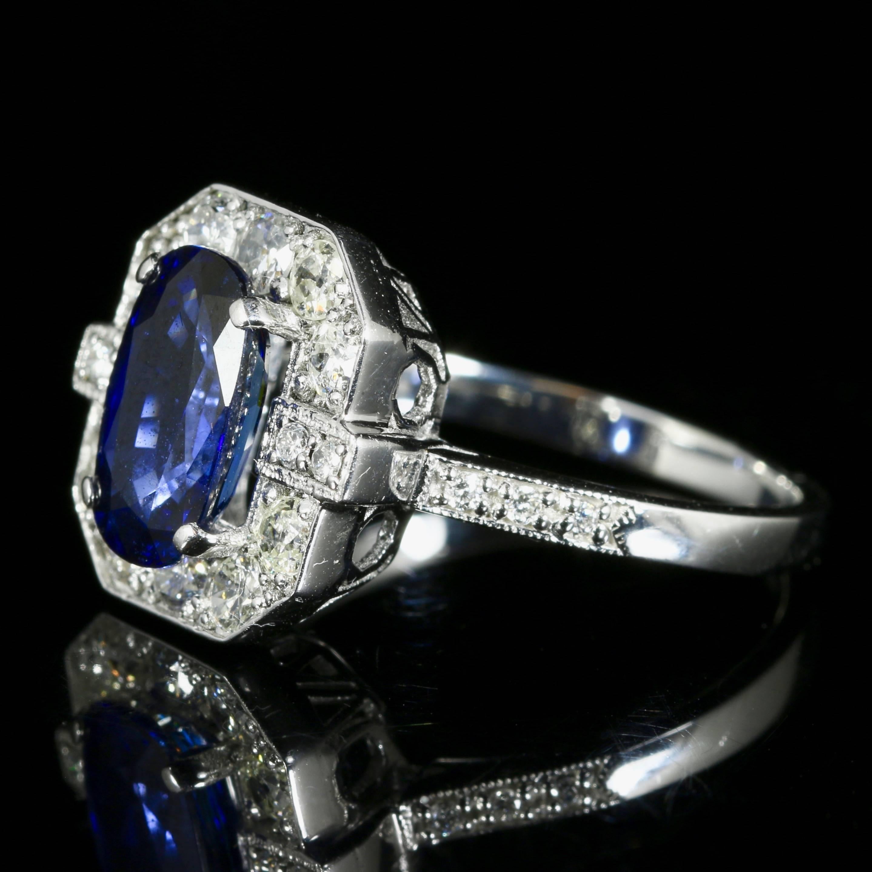 This is a very beautiful 18ct white gold ring which boasts a fabulous rich blue sapphire and encrusted with old cut diamonds.

The ring is set with a 2.50ct sapphire in the centre which is surrounded by magnificent diamonds, even taper down the
