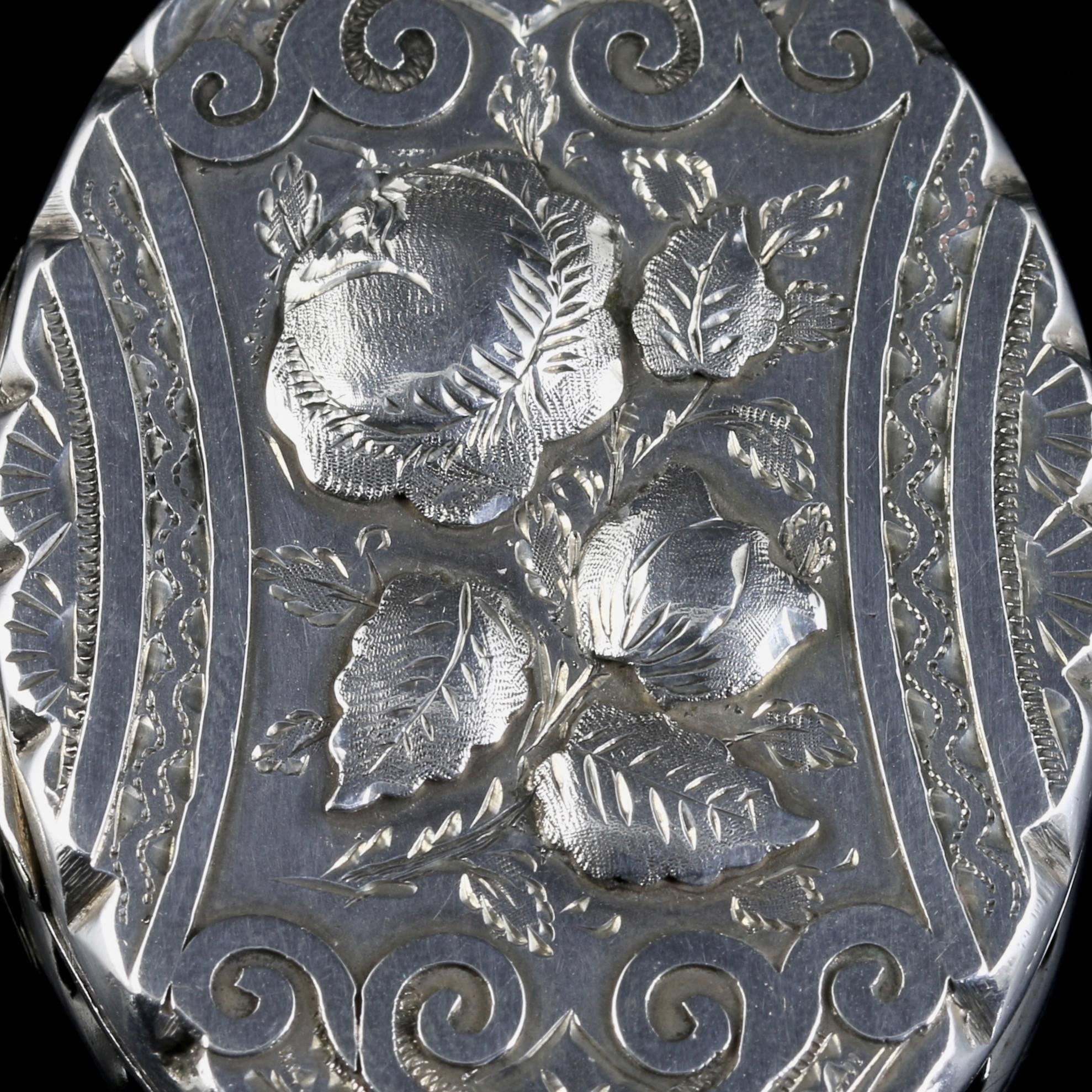 This is an absolutely stunning sterling silver antique Victorian locket. 

Fully hallmarked Birmingham 1884.

This is an outstanding example of a popular Victorian piece which allowed owners to keep two pictures of their loved ones close to them at