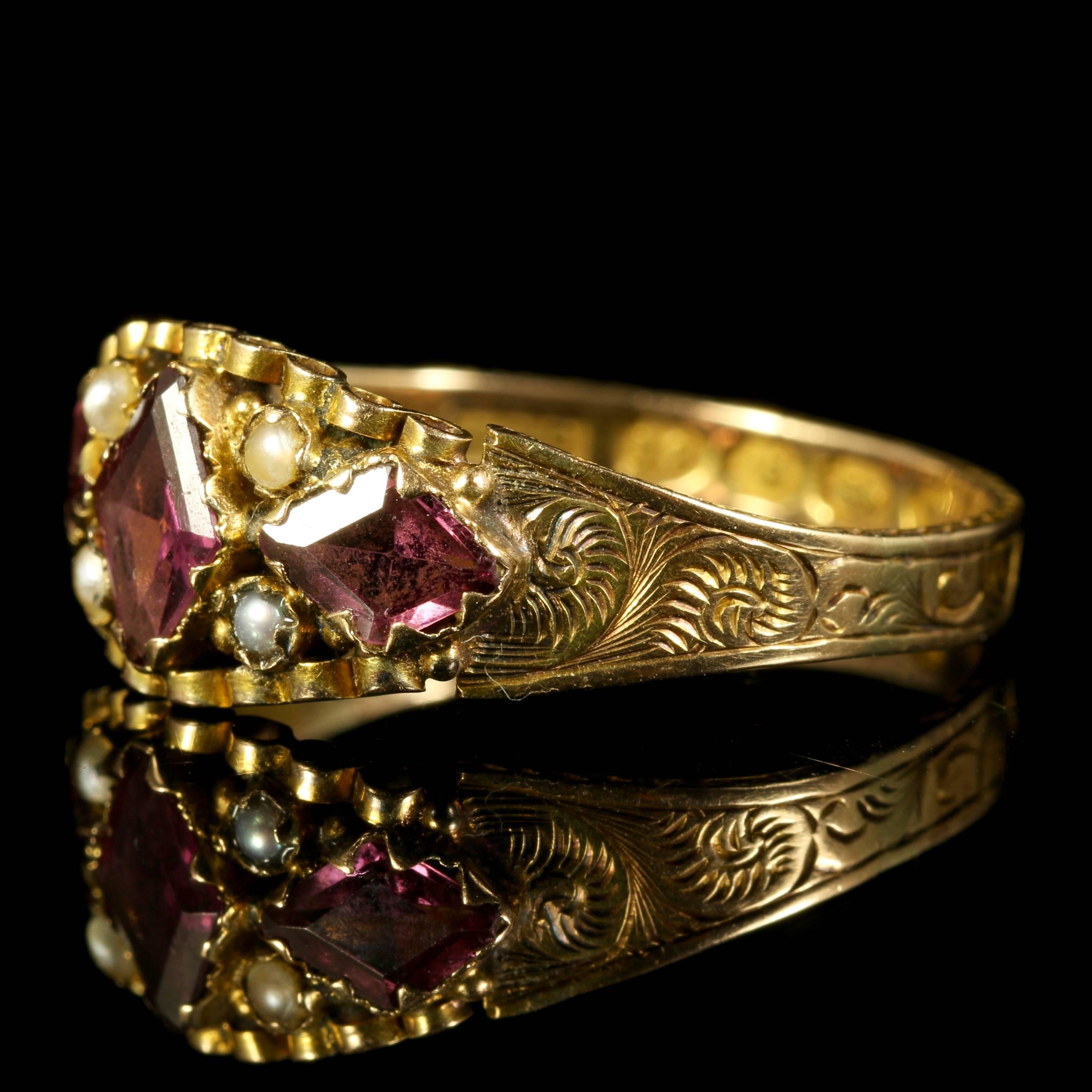 This is a fabulous genuine Georgian ring which is fully hallmarked Birmingham 1791.

A very rare find indeed, to find such an old hallmark on a ring.

The ring is set with lovely Almandine Garnets and Pearls.

Set in rare 12ct gold with beautiful