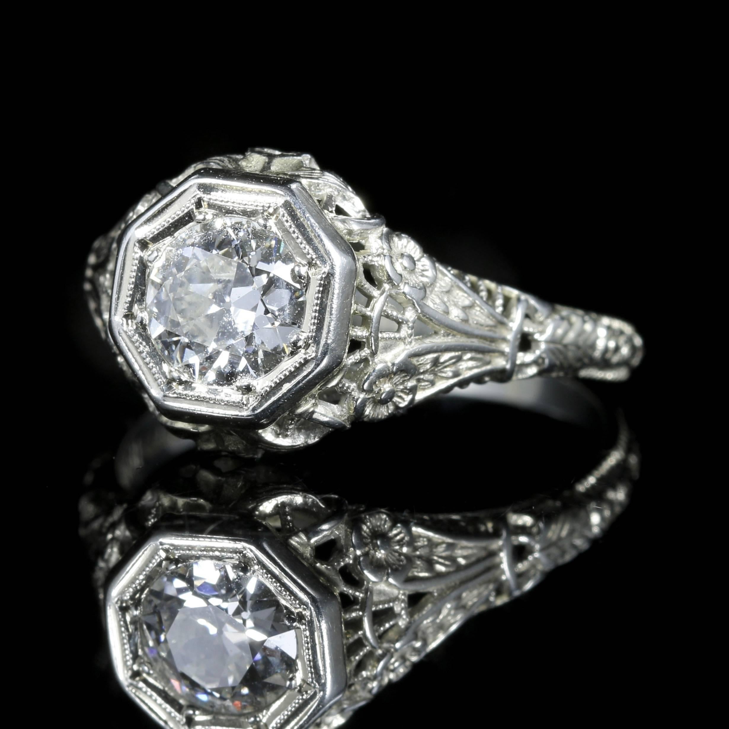 This stunning Diamond 18ct White Gold ring is genuine 1920s set in a lovely Art Deco gallery that is all original.

The central Diamond is 1.10ct set in a beautiful decorative gallery.

The large central solitaire is SI2 H/I Colour which is set into
