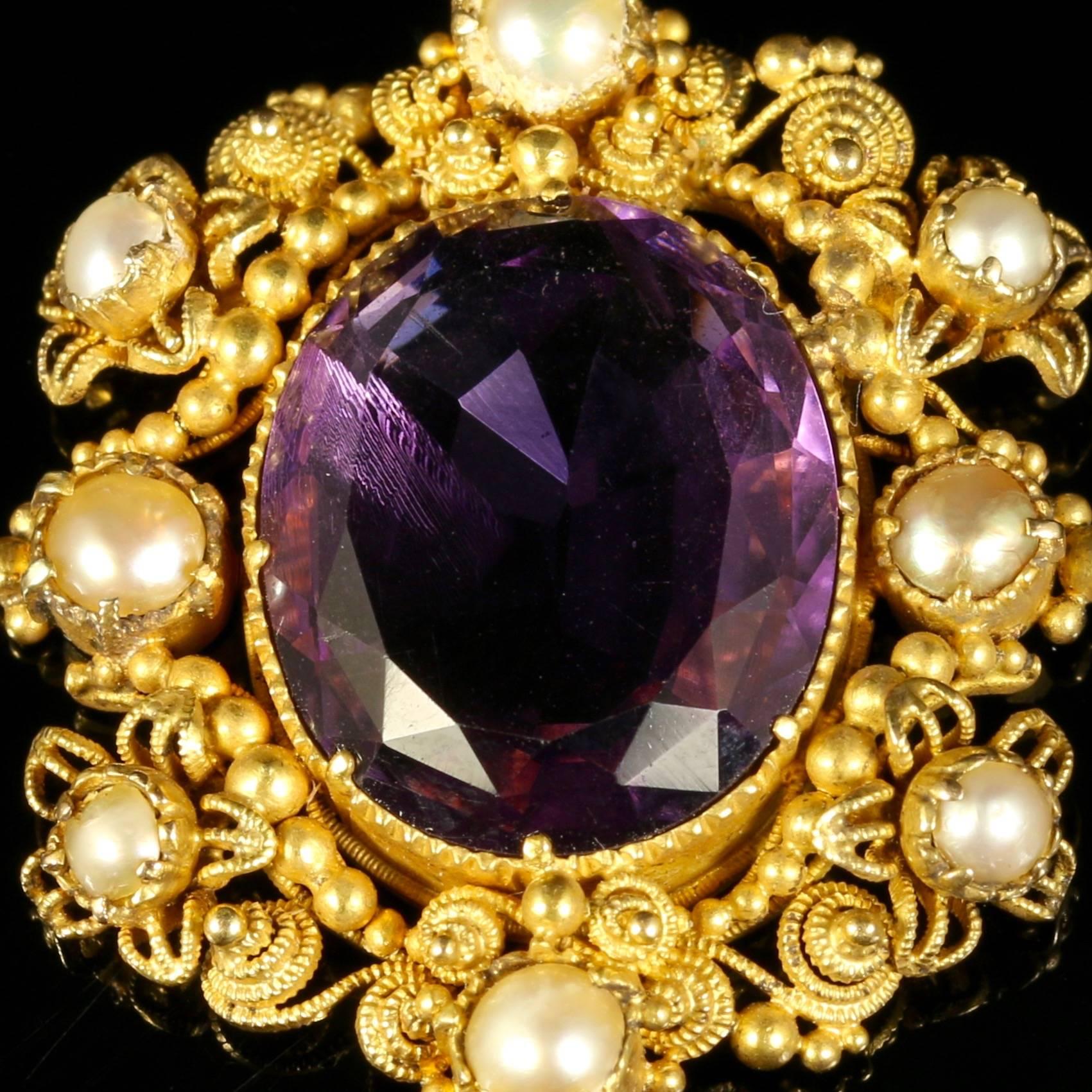 This beautiful, genuine, Georgian 18ct yellow gold pendant is set with a fabulous large rich velvet Amethyst which is milligrain set into the pendant.

This pendant is Circa 1800.

A lovely piece of Georgian history, over 200 years old.

Adorned by