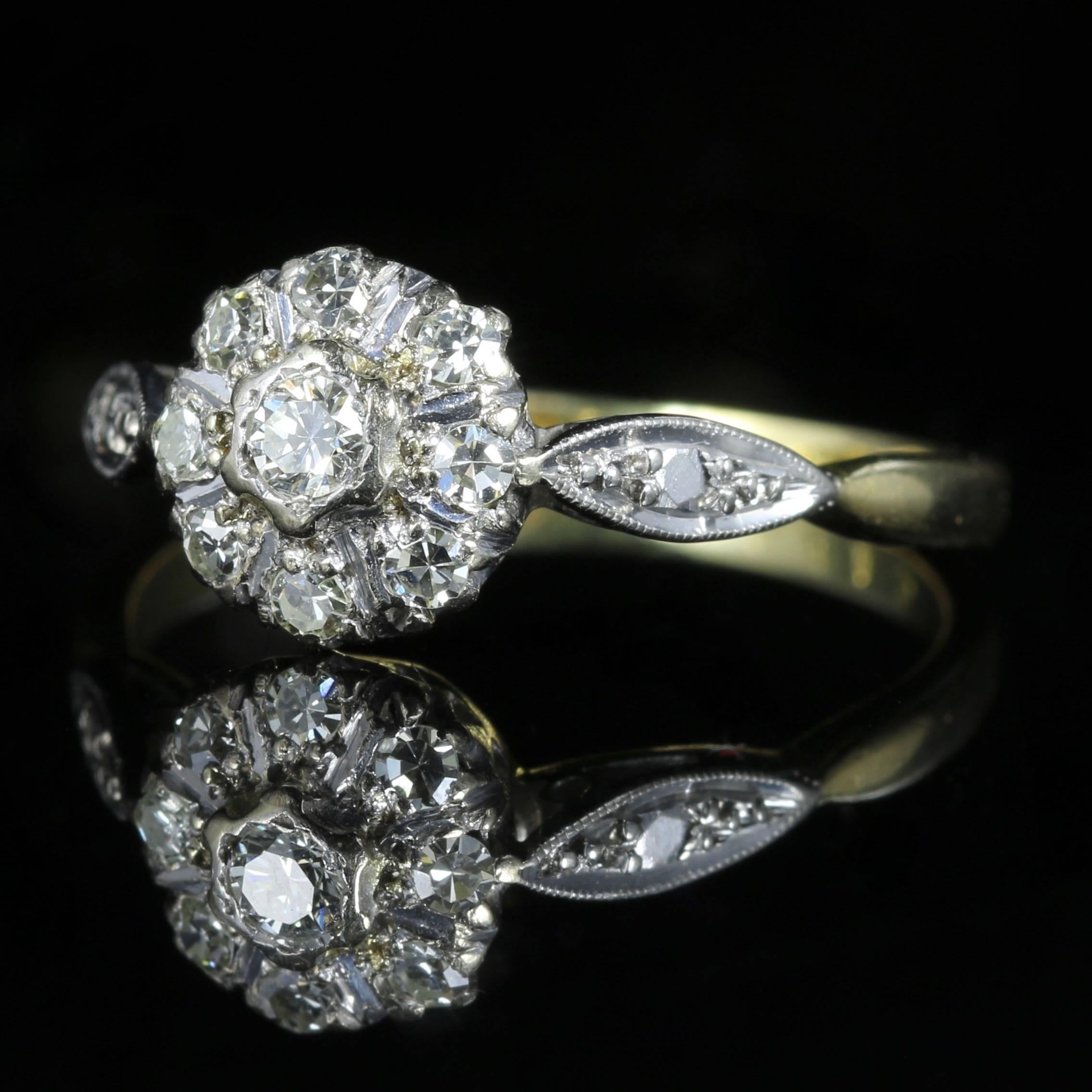 This stunning Antique 18ct yellow Gold and Platinum ring boasts a cluster of Diamonds that are all original to the ring. Circa 1915

It is stamped 18ct but this is quite worn. 

This lovely ring is set with an approx. of 0.80ct of Diamonds. They are