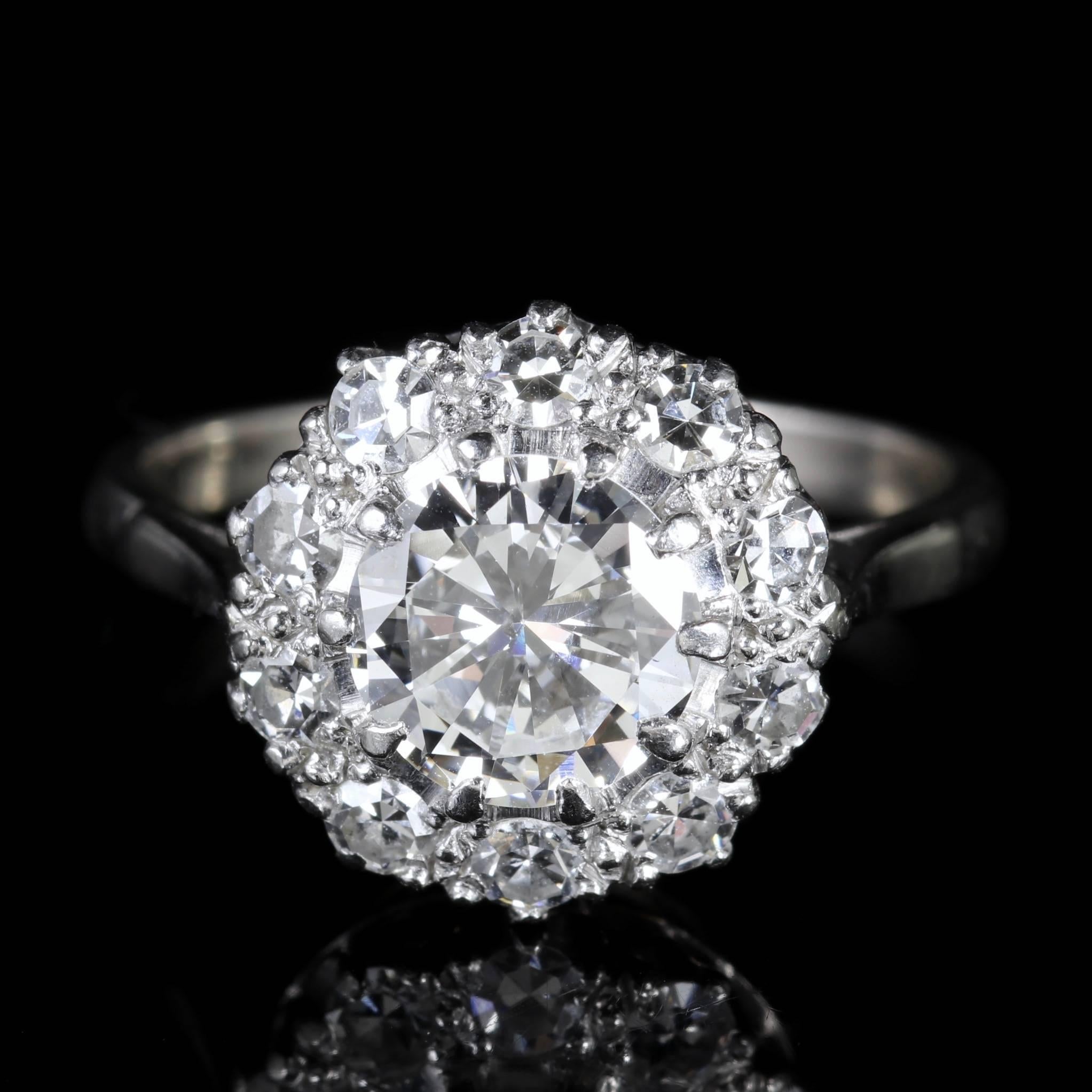 This fabulous antique Edwardian all Platinum Diamond ring is Circa 1915.

The large old cut solitaire Diamond is 1.60ct in size with additional diamonds set around the large central Diamond.

The Diamonds sparkle beautifully complimenting the