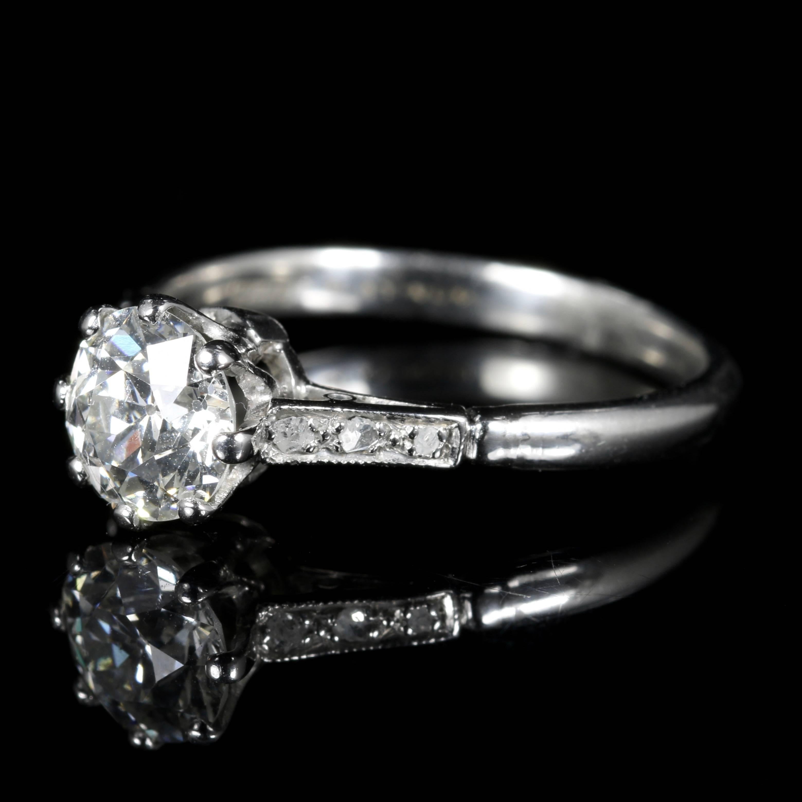 This fabulous antique Edwardian all Platinum Diamond ring is Circa 1915.

The large old cut Diamond solitaire is 1.30ct in size with additional Diamonds chasing down each shoulder.

The Diamonds sparkle beautifully complimenting the platinum.

There