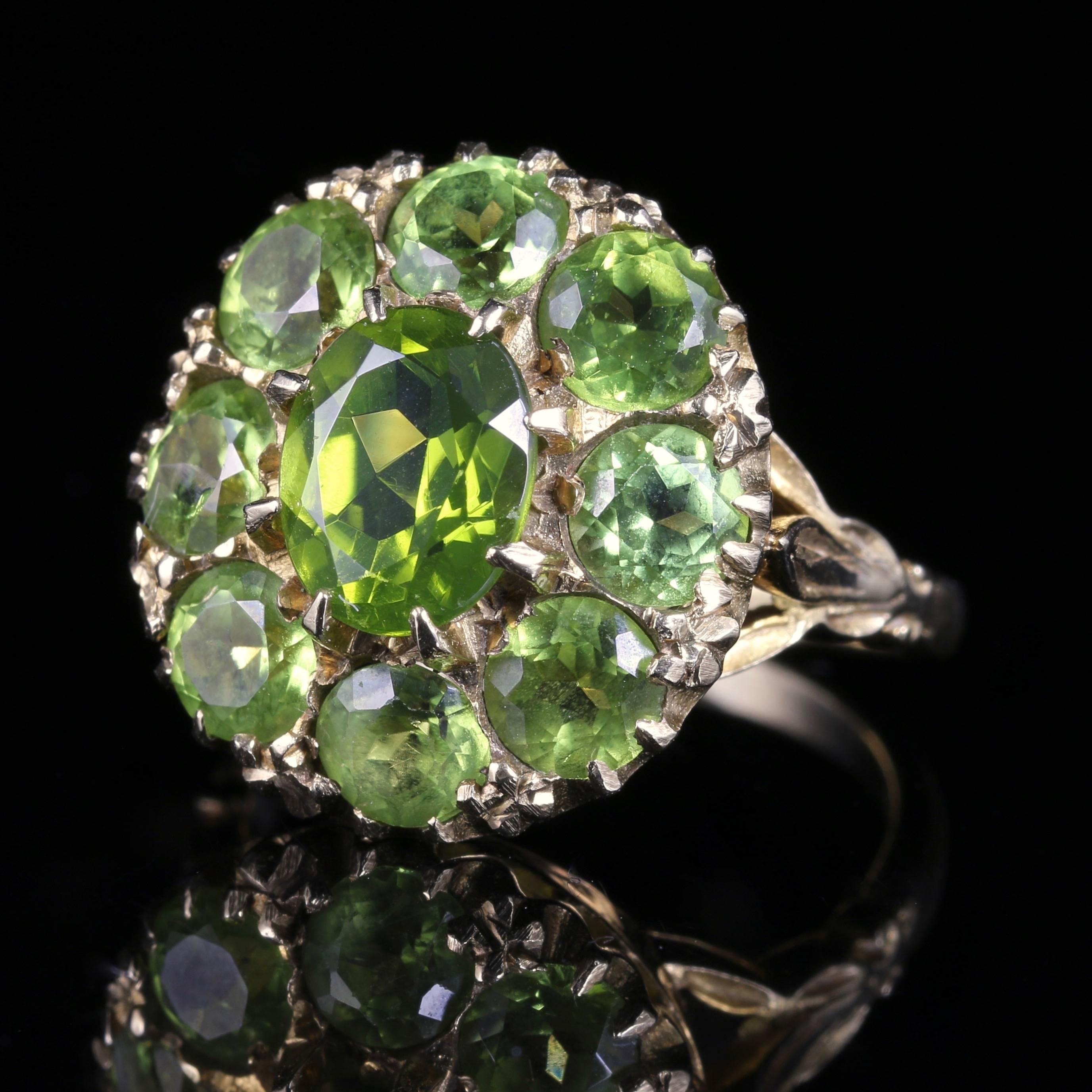 This fabulous antique 9ct yellow Gold cluster ring is set with beautiful rich olive green Peridots.

The Peridot is a stone of lightness and beauty and was believed to be a stone of springtime by ancients who considered it a gift from Mother