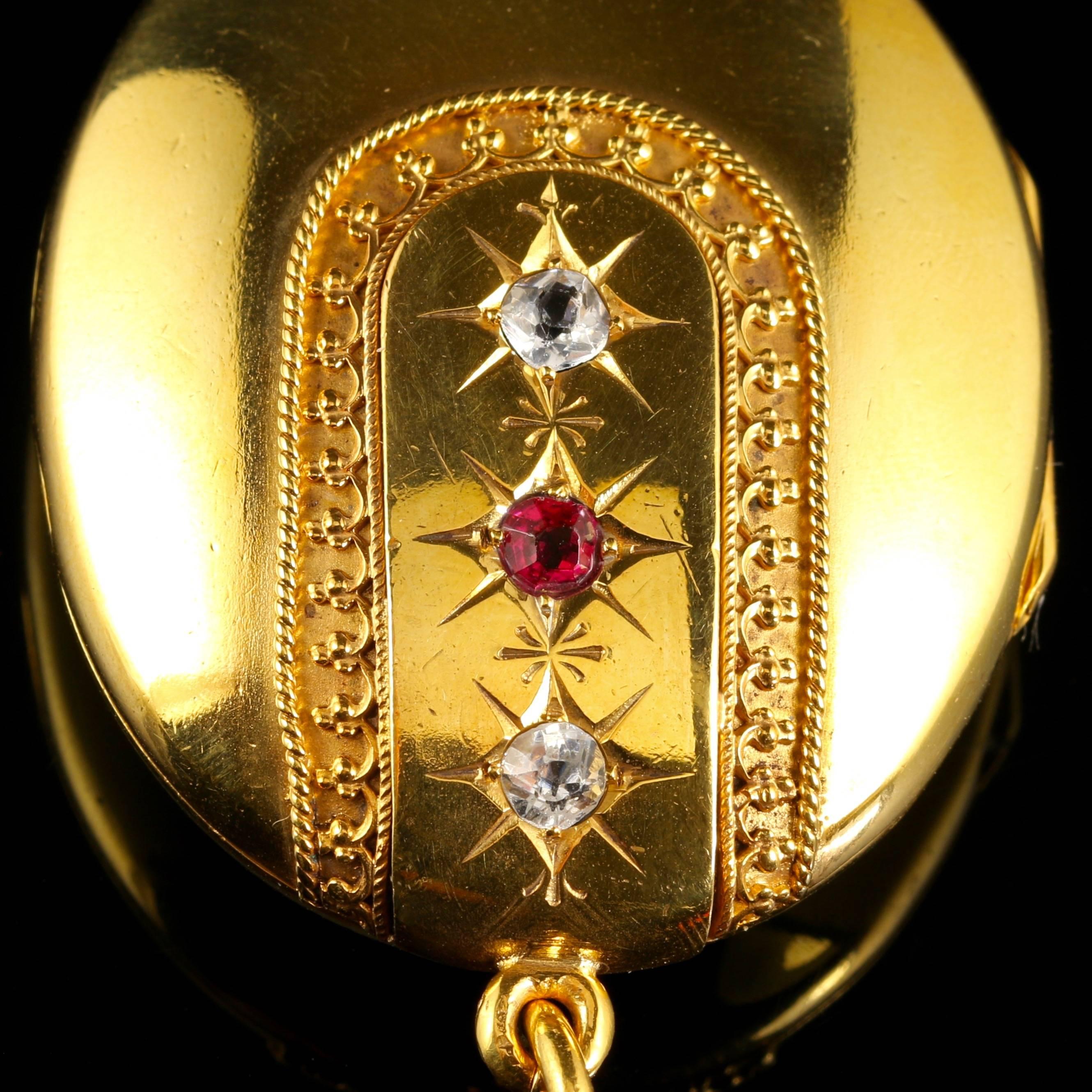 This fabulous Antique Victorian large 18ct gilt locket is Circa 1900.

This lovely locket is set with three Paste Stones down the central gallery bordering cannetille workmanship complimented with a rope twist finish.

Paste is a heavy, very
