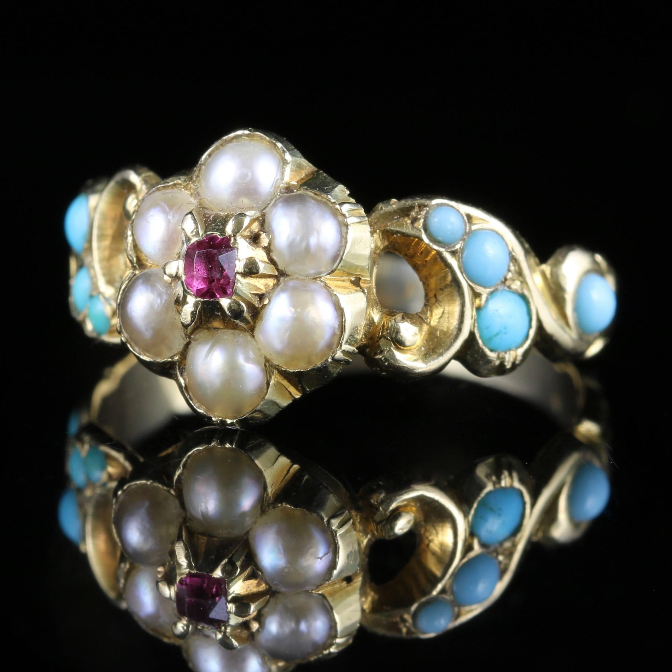 This is a stunning Georgian 18ct yellow Gold Antique ring Circa 1800, set with fabulous Georgian workmanship of its time, all original to the gallery and shank.

The central stone is a Ruby surrounded by natural Pearls.

Pearls have a wonderful