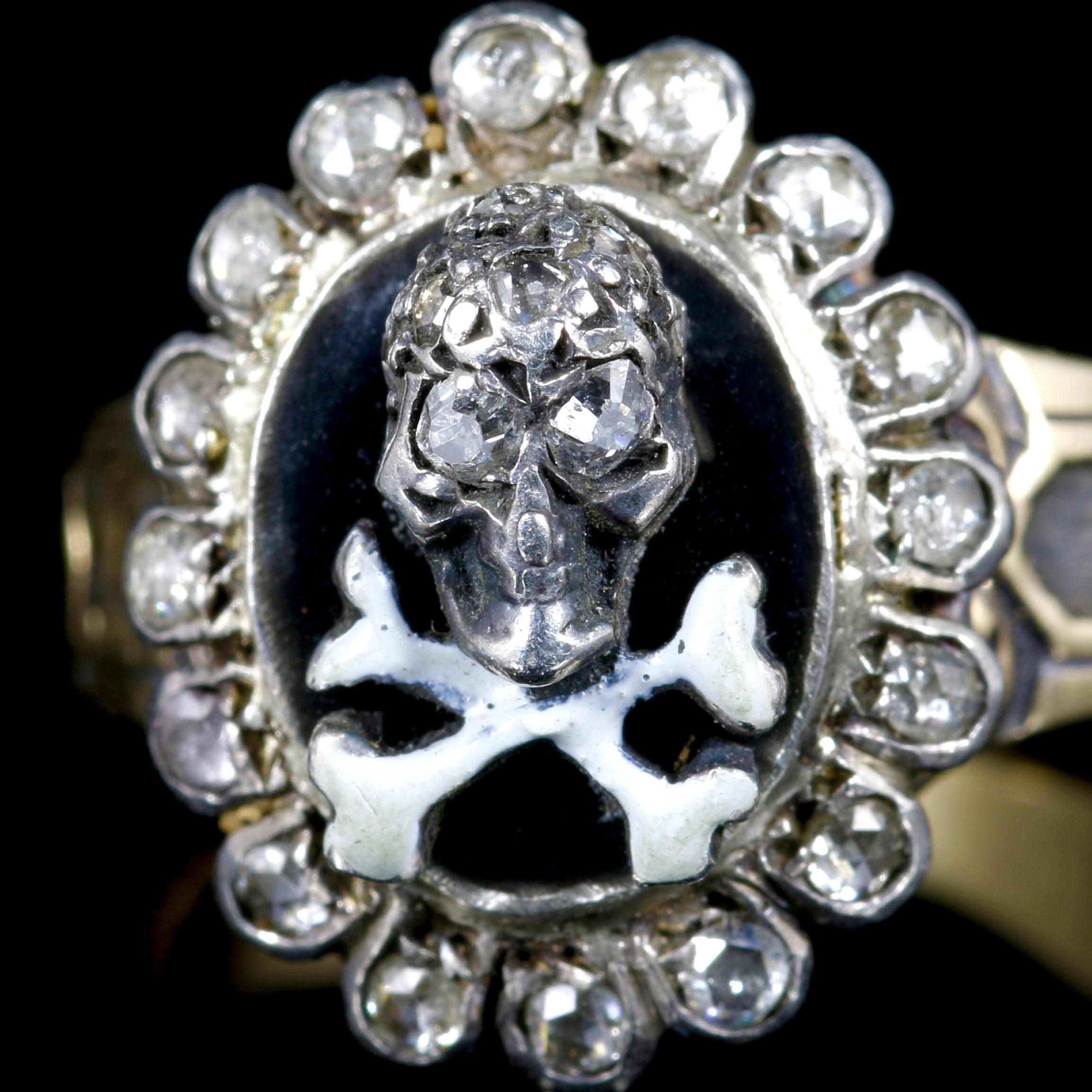 This 18ct Yellow Gold Memento Mori Diamond Skull and Crossbone ring is fabulous.

The skull and crossbones are surrounded by Diamonds in the outer gallery leading to an ornate gallery and shank.

Skull jewellery (Memento Mori) is very collectable.