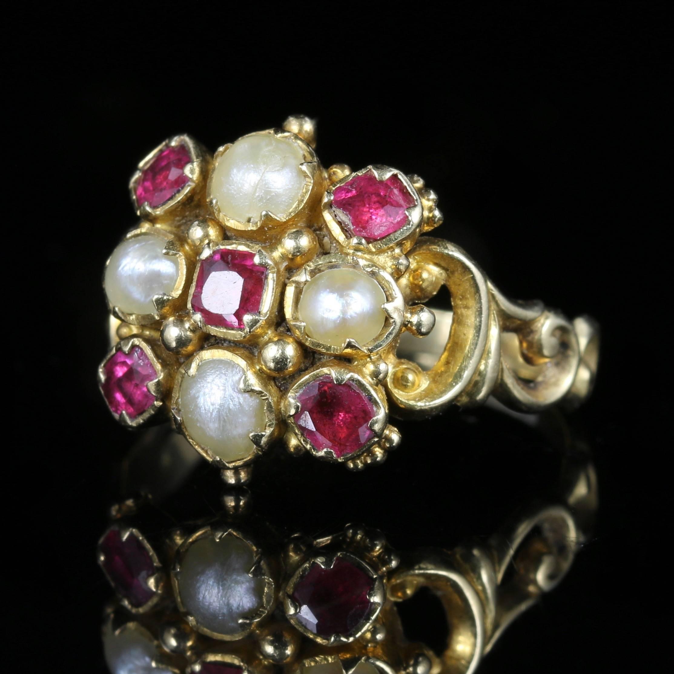This is a stunning Georgian 18ct yellow Gold Antique ring set with fabulous Georgian workmanship of its time, all original to the gallery and shank.

Circa 1800

The ring is set with beautiful Rubies and natural Pearls.

Pearls have a wonderful