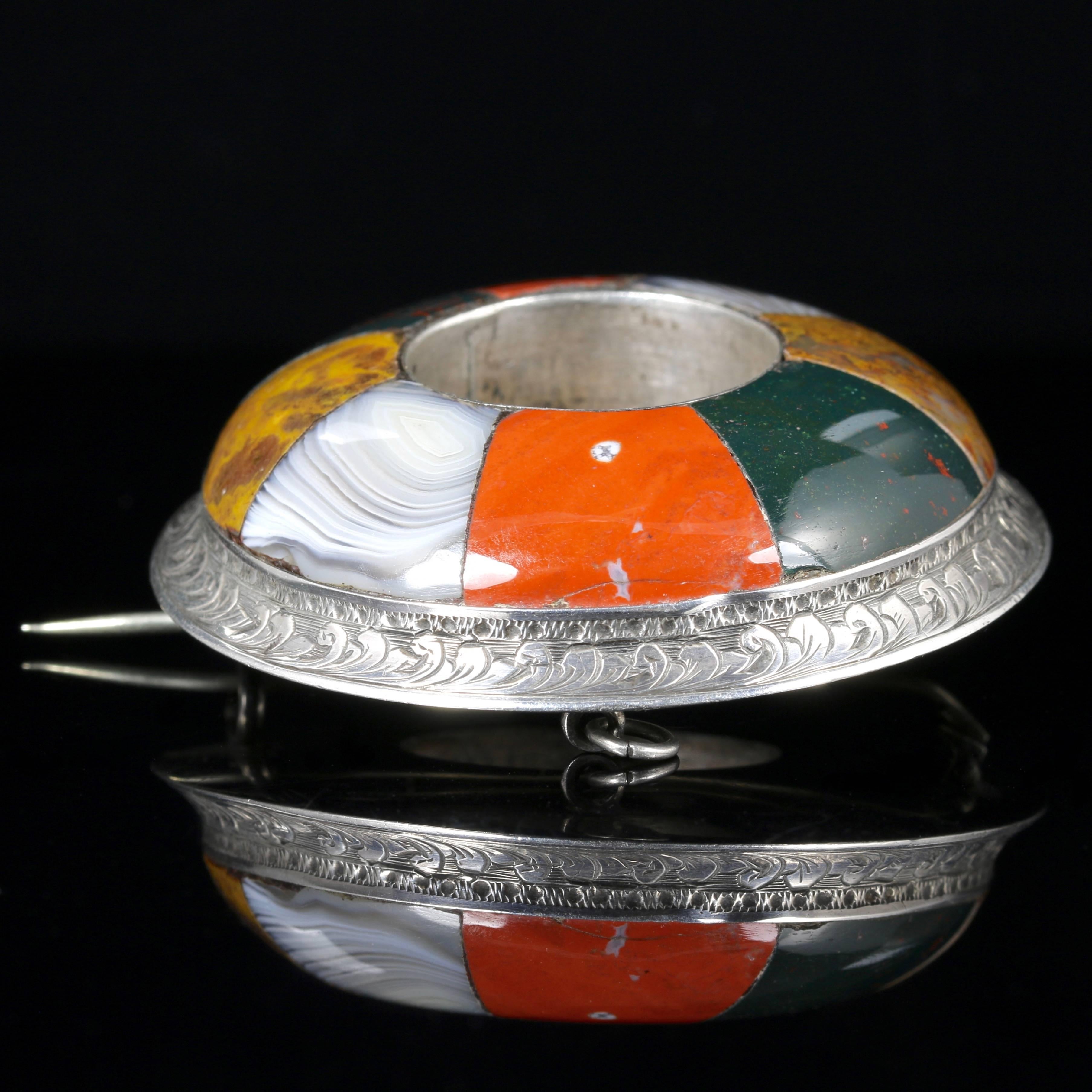 This is a fabulous large Sterling Silver plaid Scottish Agate brooch, set with inlaid Scottish Agates.

This is most unique, it is Circa 1860. 

This beautiful Scottish Silver brooch has the most pristine workmanship throughout.

The brooch