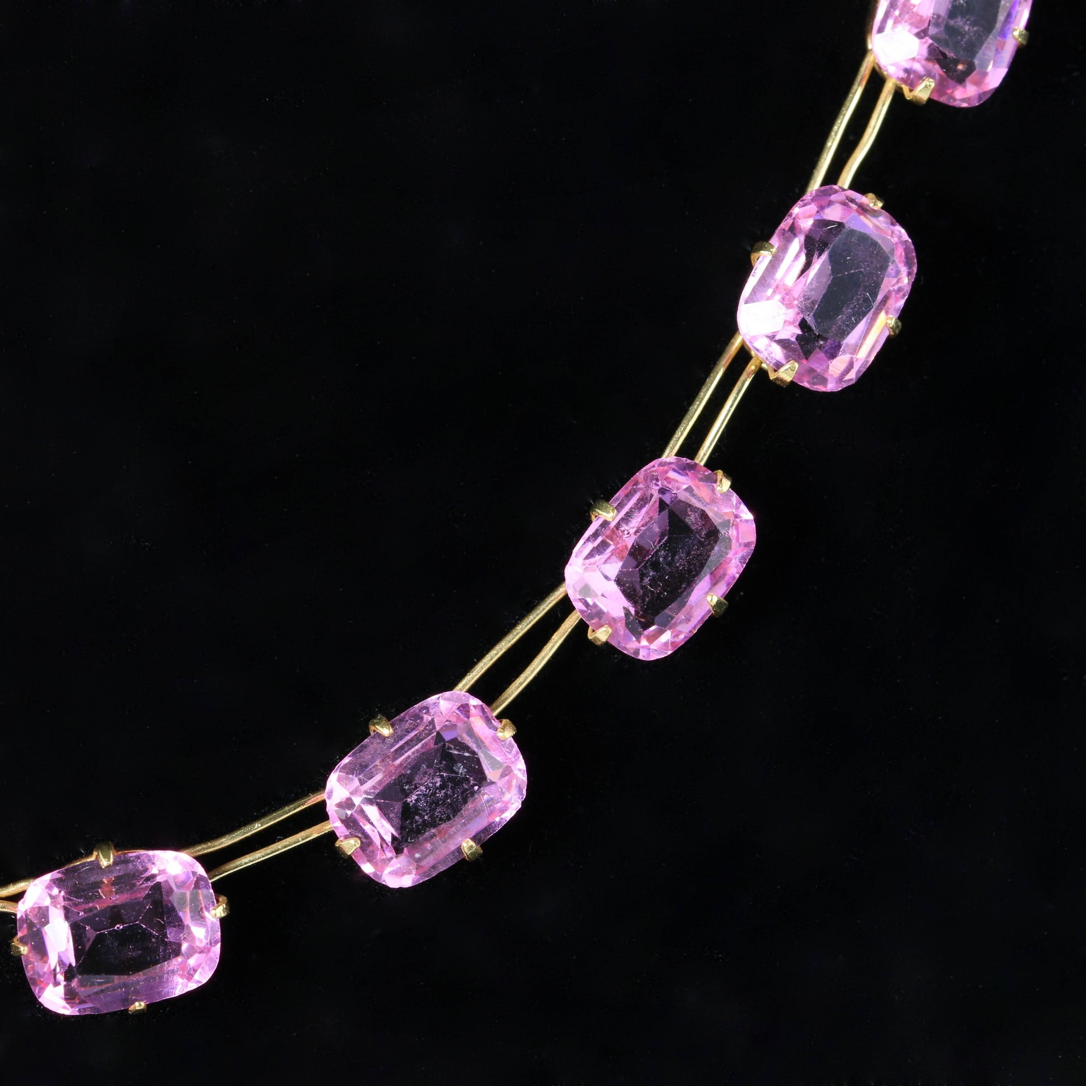 This very beautiful Victorian necklace is set with lovely pink Paste stones, Circa 1900

Set in sterling Silver and gilded in 18ct yellow Gold.

Paste is a heavy, very transparent flint glass that stimulates the fire and brilliance of gemstones