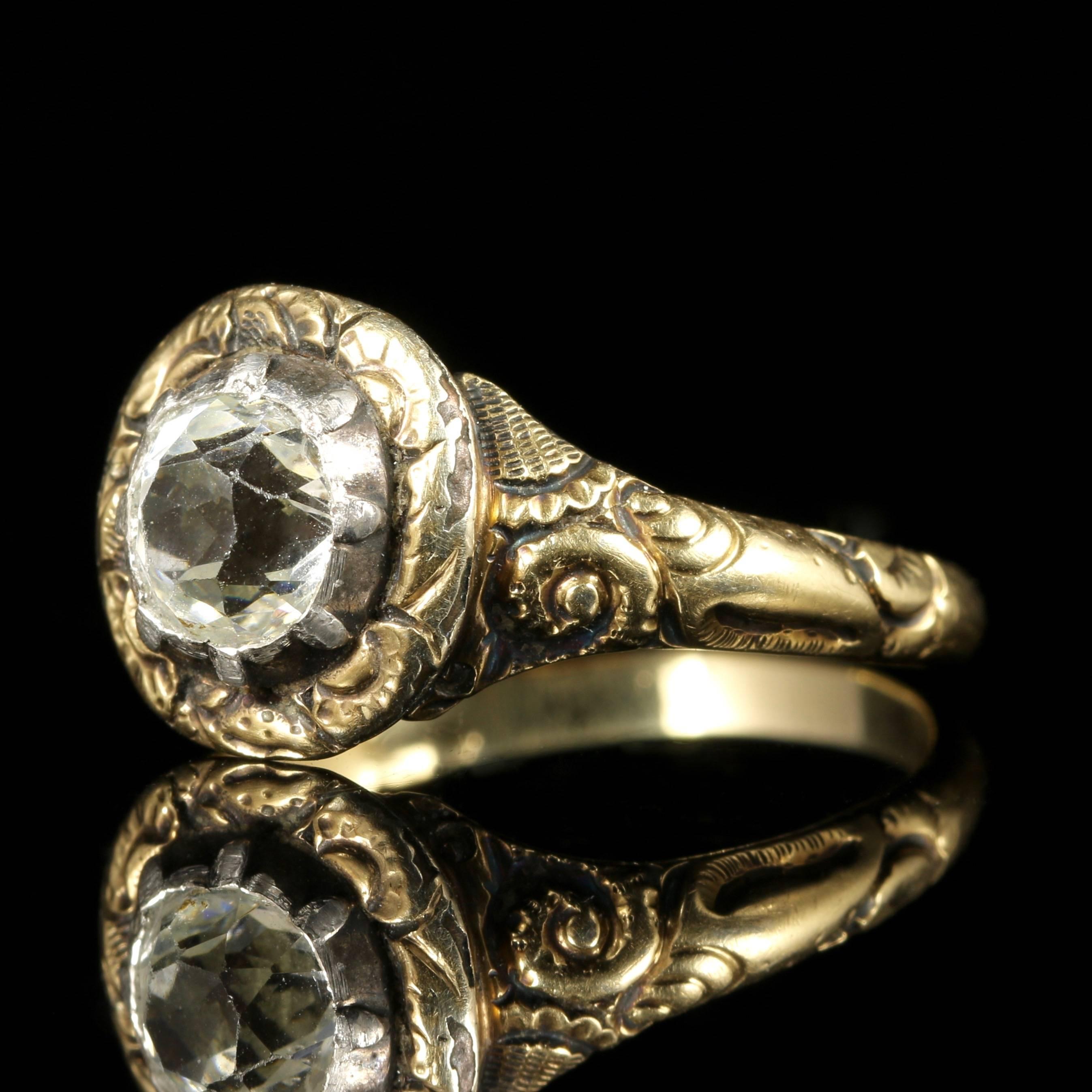 This beautiful Georgian ring is set in 18ct Yellow Gold with a fabulous 0.80ct old cushion cut Paste Stone.

Paste is a heavy, very transparent flint glass that stimulates the fire and brilliance of gemstones, the Romans in particular were very